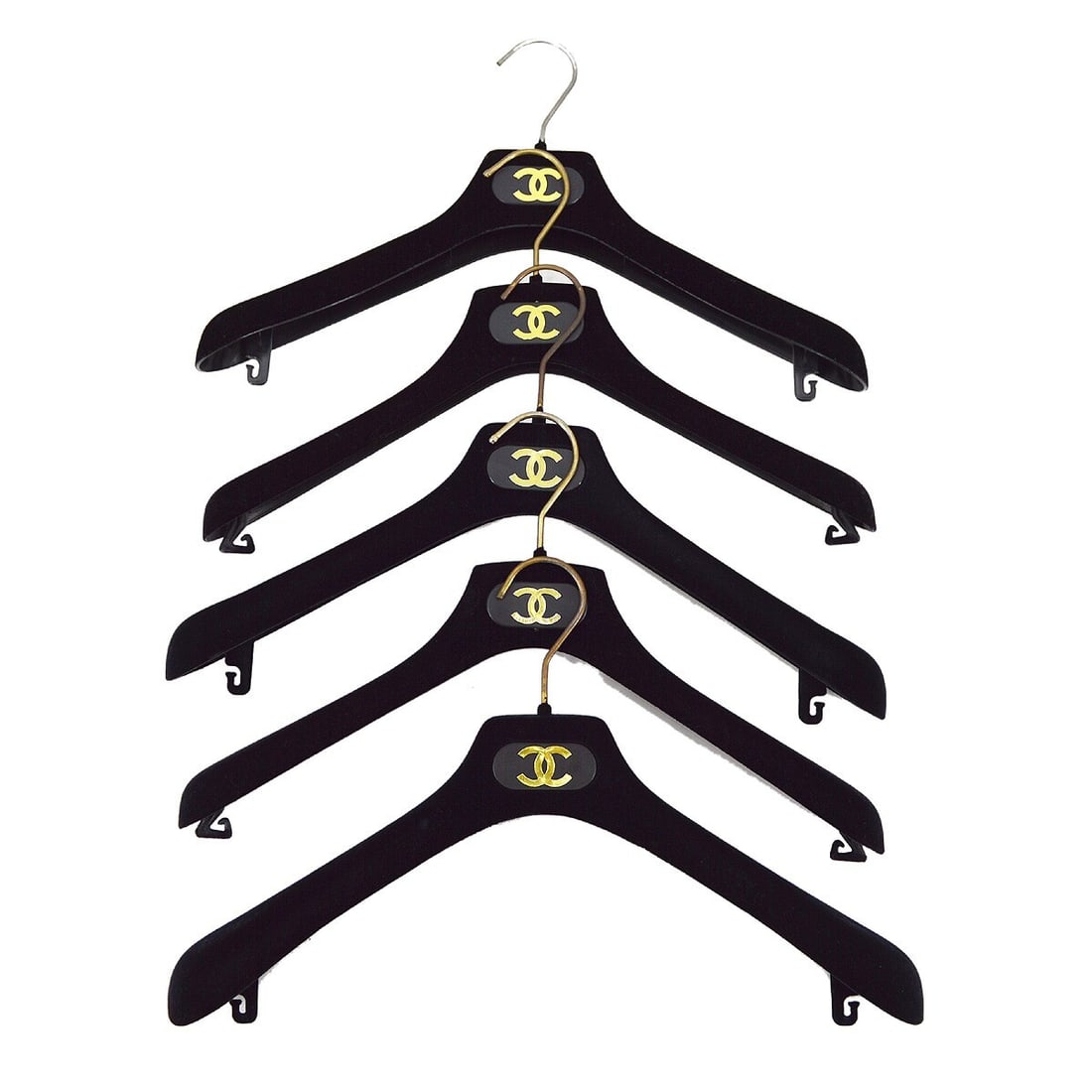 Set of 5 Chanel black velvet traditional hangers: Set of 5 Chanel black velvet traditional hangers Black Chanel traditional hangers made with velvet construction. The listing specifies a 5-piece set and notes reasonable wear and tear on the outside c