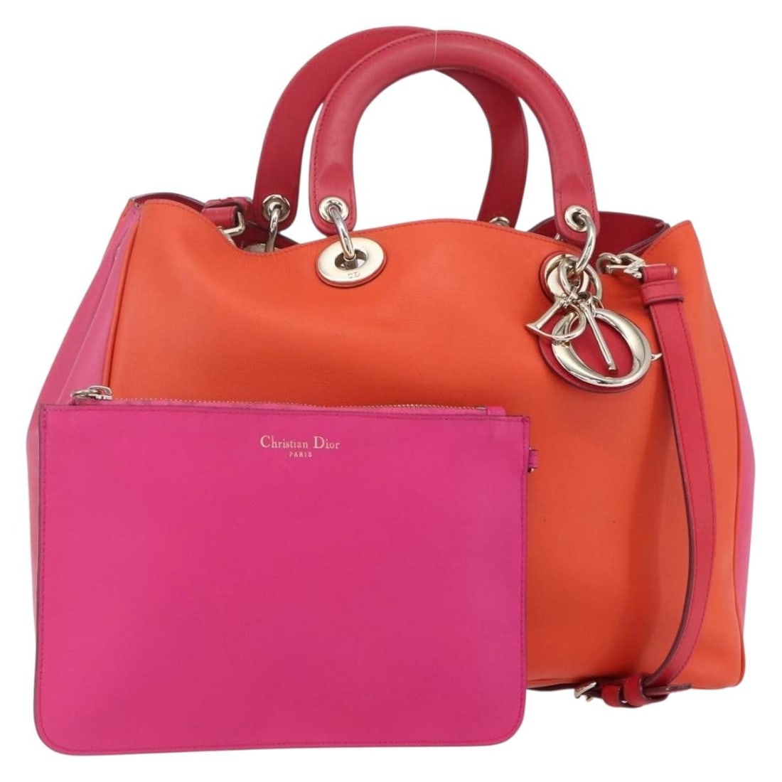 Christian Dior Diorissimo leather 2way handbag orange with strap pouch charm: Christian Dior Diorissimo leather 2way handbag orange with strap pouch charm Christian Dior Diorissimo 2-way handbag in orange leather with gold-tone accents. Made in Italy, this women's bag includes 