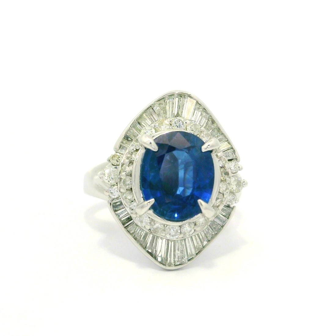 GIA Certified Platinum Ballerina Ring with 2.99ctw Sapphire and Diamonds: GIA Certified Platinum Ballerina Ring with 2.99ctw Sapphire and Diamonds Vintage ballerina-style cocktail ring featuring a natural blue oval sapphire accented by numerous natural diamonds. Crafted in 