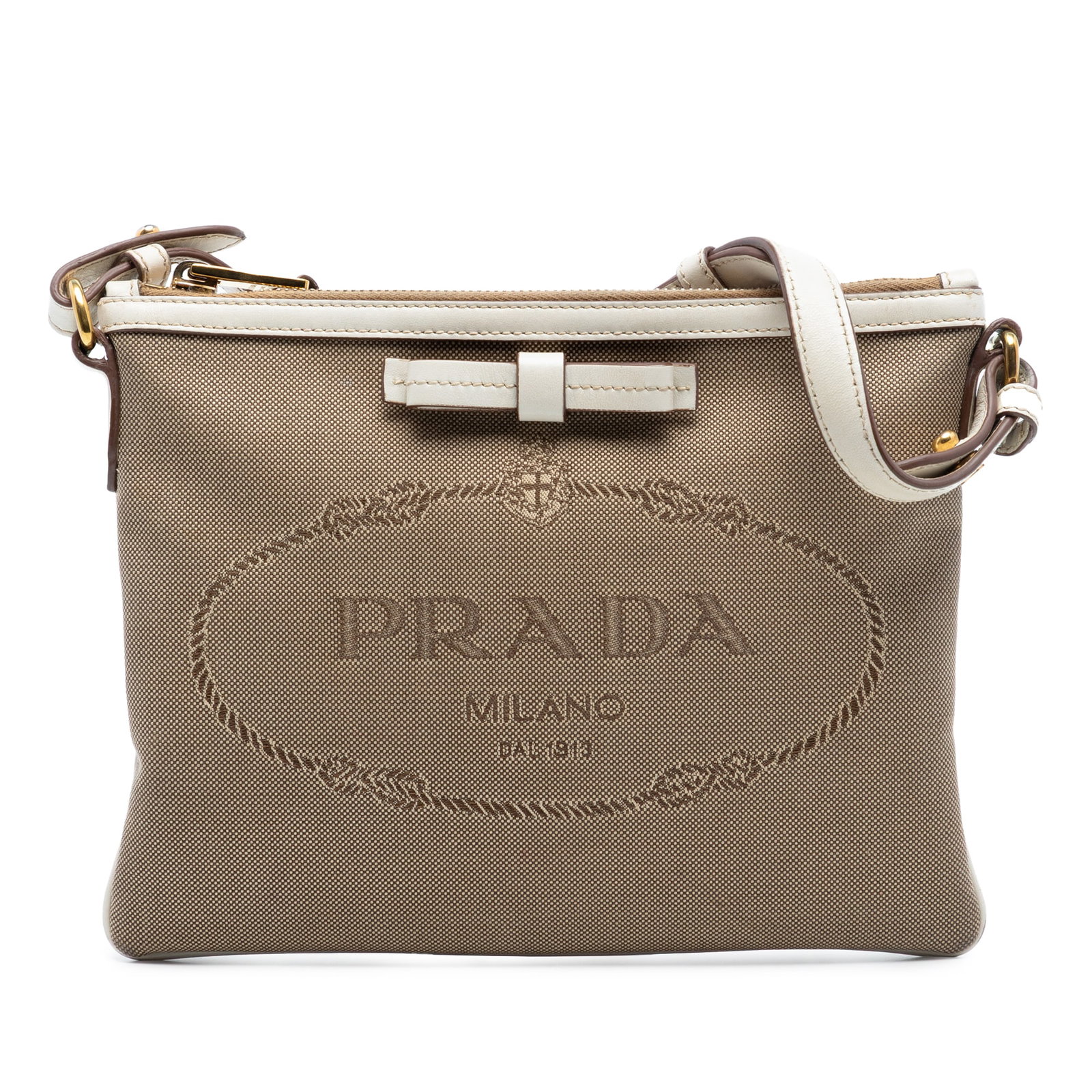 Prada Canapa Bow Beige Canvas Crossbody Bag with Logo Detail: Prada Canapa Bow Beige Canvas Crossbody Bag with Logo Detail This Prada Canvas Canapa Logo Bow Crossbody features a canvas body with leather trim, a flat leather strap, a top zip closure, and an inter