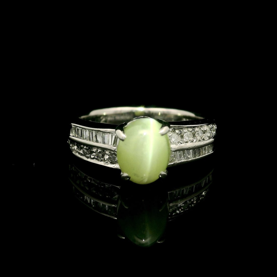 Vintage Platinum 2.22ctw Oval Cabochon Cat's Eye Diamond Cocktail Ring: Vintage Platinum 2.22ctw Oval Cabochon Cat's Eye Diamond Cocktail Ring This exquisite vintage cocktail ring features a stunning natural genuine cat's eye stone, showcased in an oval cabochon cut, pron