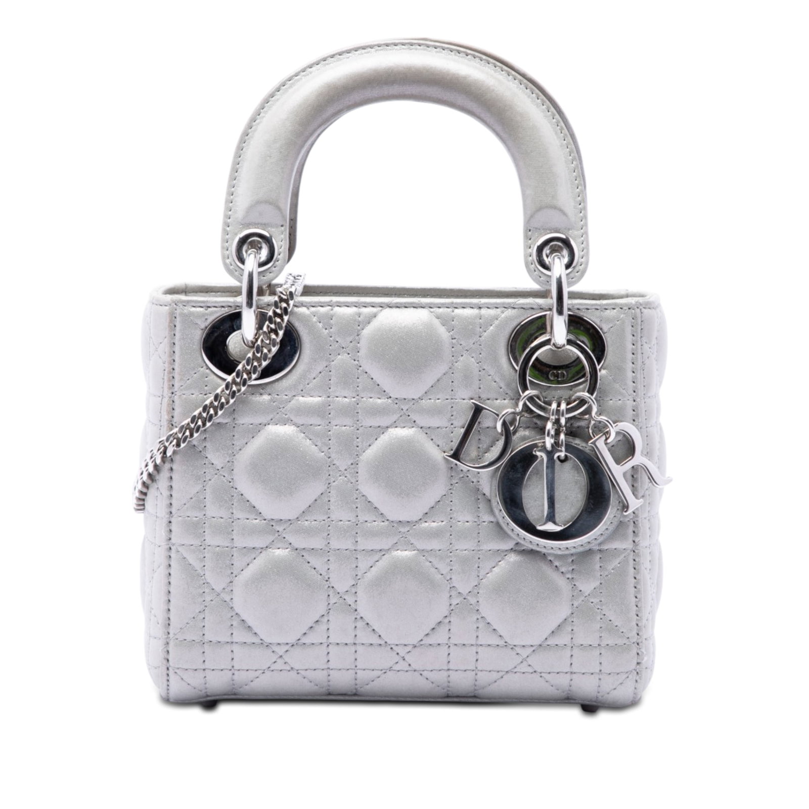 Dior Lady Dior Mini Cannage Iridescent Lambskin Bag Silver: Dior Lady Dior Mini Cannage Iridescent Lambskin Bag Silver The Mini Iridescent Lambskin Cannage Lady Dior is a silver bag crafted in iridescent quilted lambskin leather. It features flat leather top h