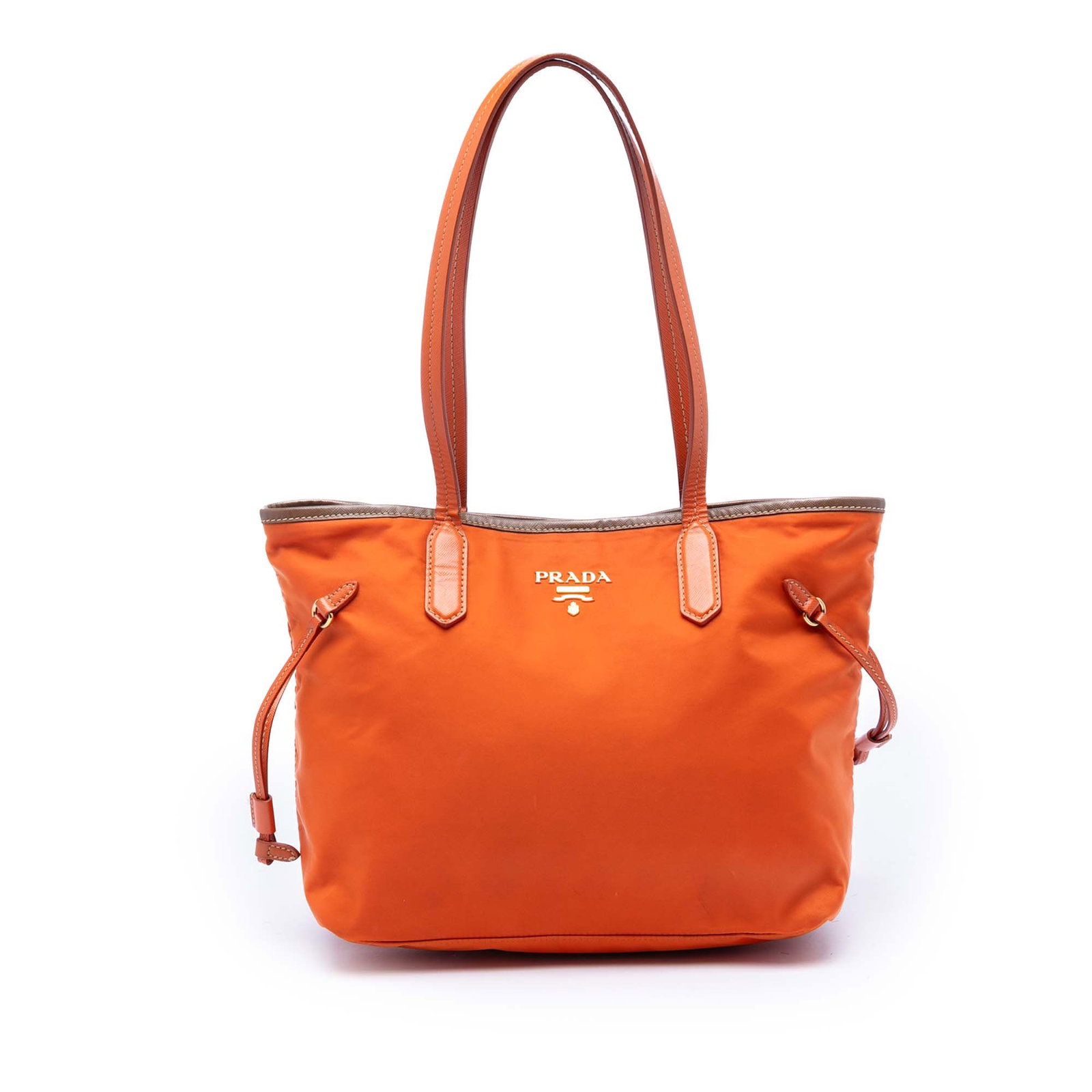 Prada orange nylon tote with saffiano leather trim: Prada orange nylon tote with saffiano leather trim This Prada Saffiano Trimmed Tessuto Open Tote features a durable orange nylon body accented with saffiano leather trim and flat leather straps. The b