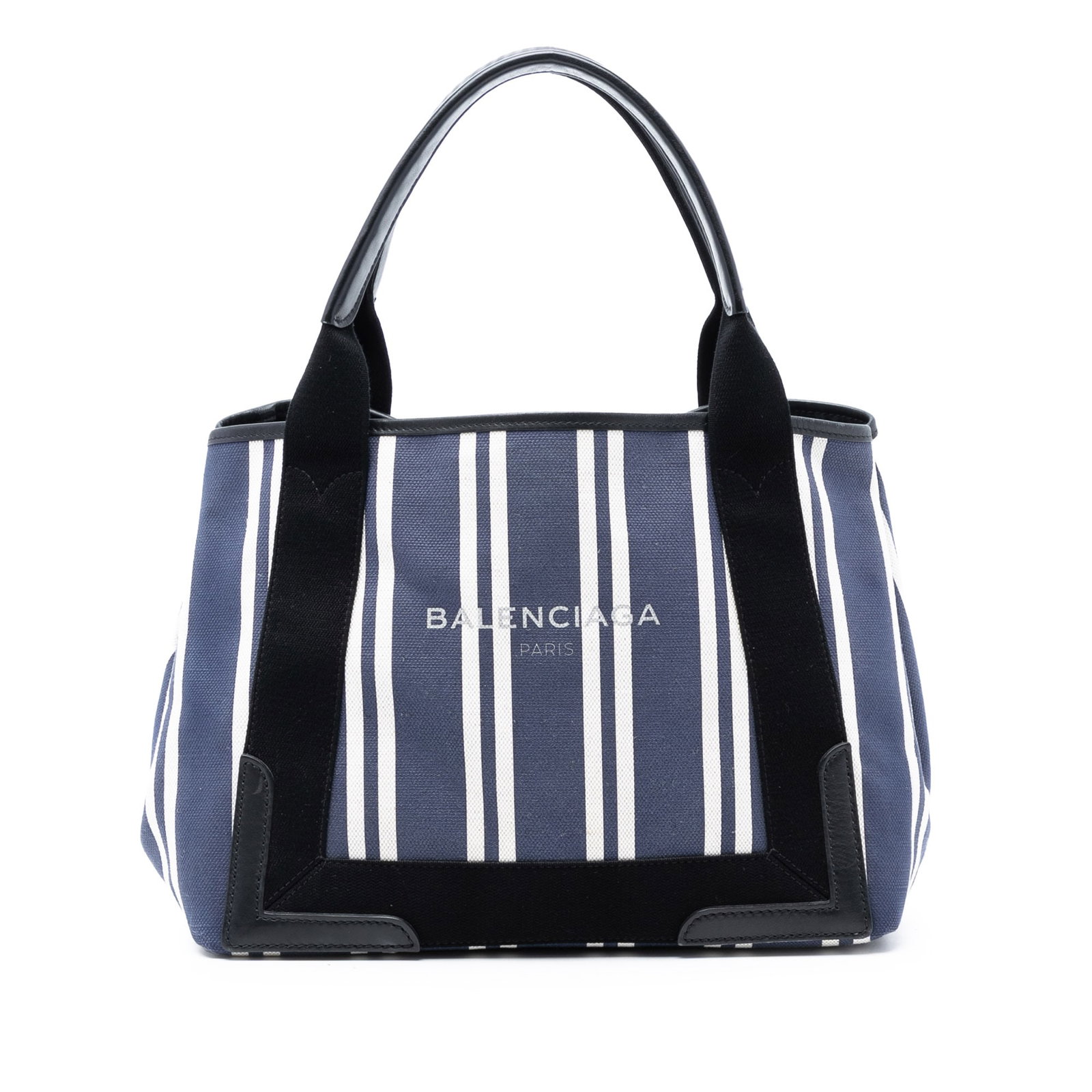 Balenciaga Navy Canvas Cabas S Tote with Striped Design: Balenciaga Navy Canvas Cabas S Tote with Striped Design This Balenciaga Canvas Striped Navy Cabas S features a canvas body with a striped design, flat leather handles, an open top with magnetic snap c