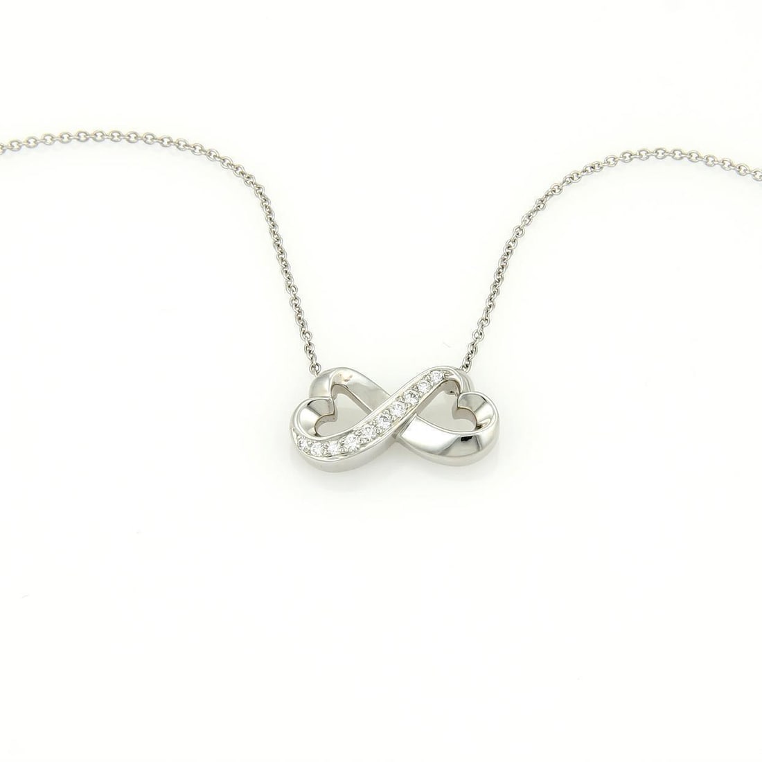 Tiffany & Co. Paloma Picasso 18k White Gold Diamond Hearts Necklace: Tiffany & Co. Paloma Picasso 18k White Gold Diamond Hearts Necklace This exquisite necklace from Tiffany & Co. is designed by Elsa Peretti and belongs to the iconic Loving Hearts collection. Crafted f