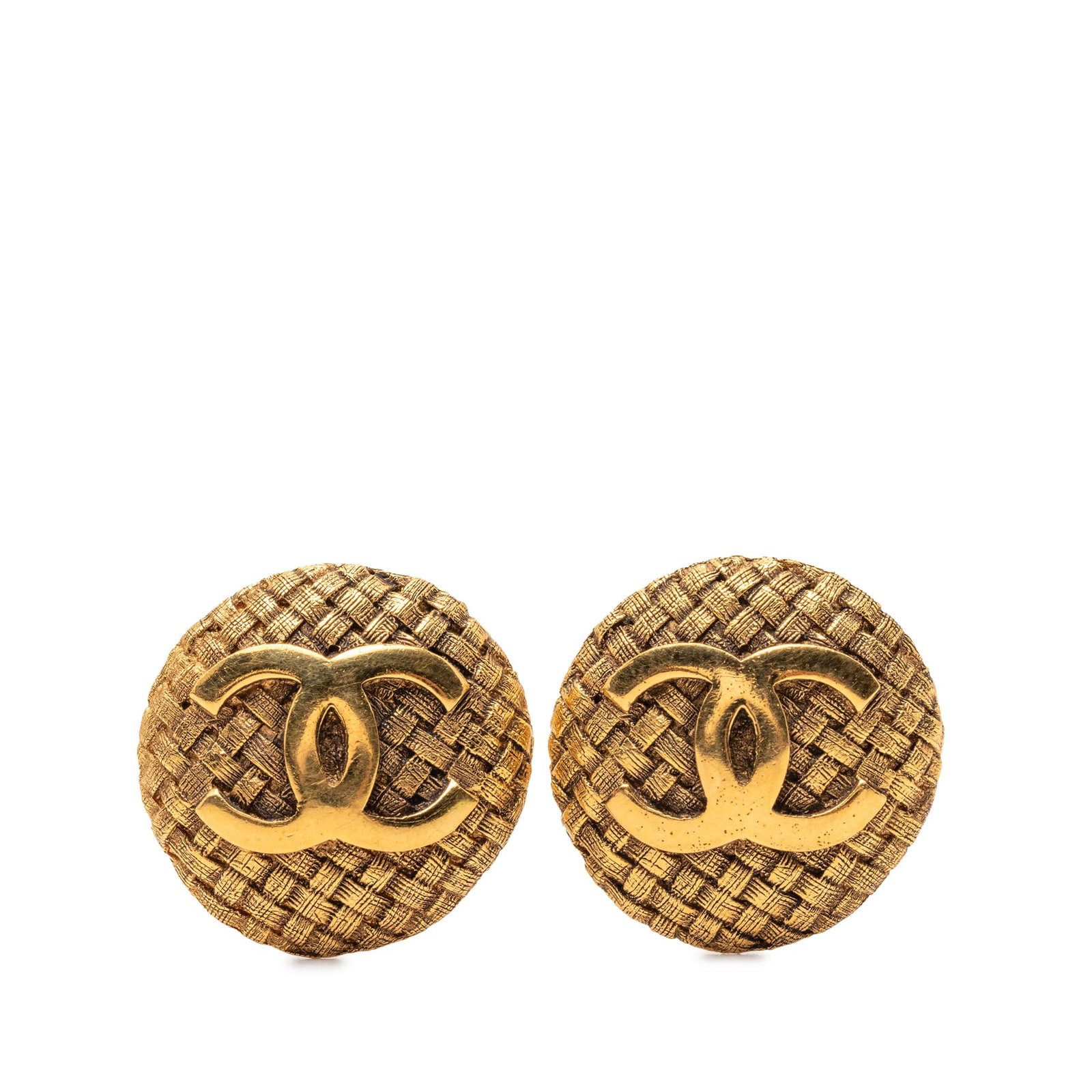 Chanel Woven Round Clip On Earrings Gold Tone Metal CC Logo: Chanel Woven Round Clip On Earrings Gold Tone Metal CC Logo These Chanel CC clip-on earrings feature a gold-tone metal body with a woven round design. Made in France, they offer a classic costume jewe