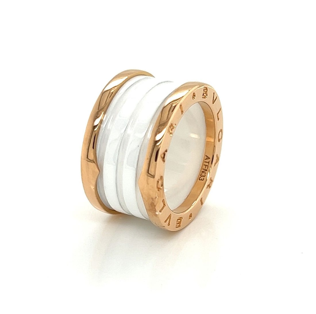 Bvlgari B.zero1 Four Band Ring 18k Rose Gold White Ceramic US 5 EU 51: Bvlgari B.zero1 Four Band Ring 18k Rose Gold White Ceramic US 5 EU 51 A Bvlgari B.zero1 four band ring crafted in 18k rose gold and white ceramic. The ring is signed and features the collection's sign