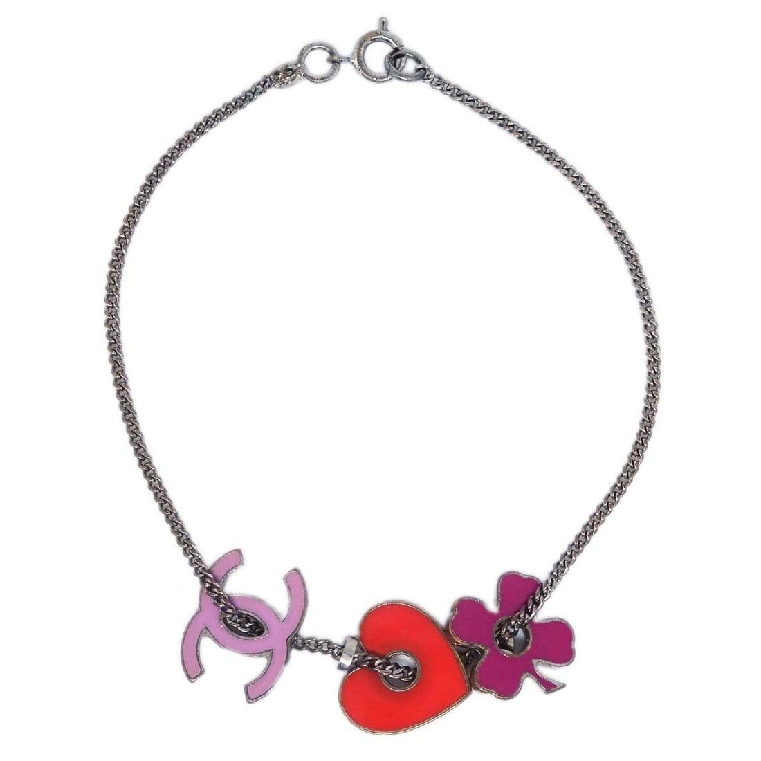 Chanel 04P silver plated chain bracelet with acrylic heart charm: Chanel 04P silver plated chain bracelet with acrylic heart charm Silver-tone chain bracelet with a heart charm from Chanel. Made in Italy, this piece features a silver-plated and acrylic construction.