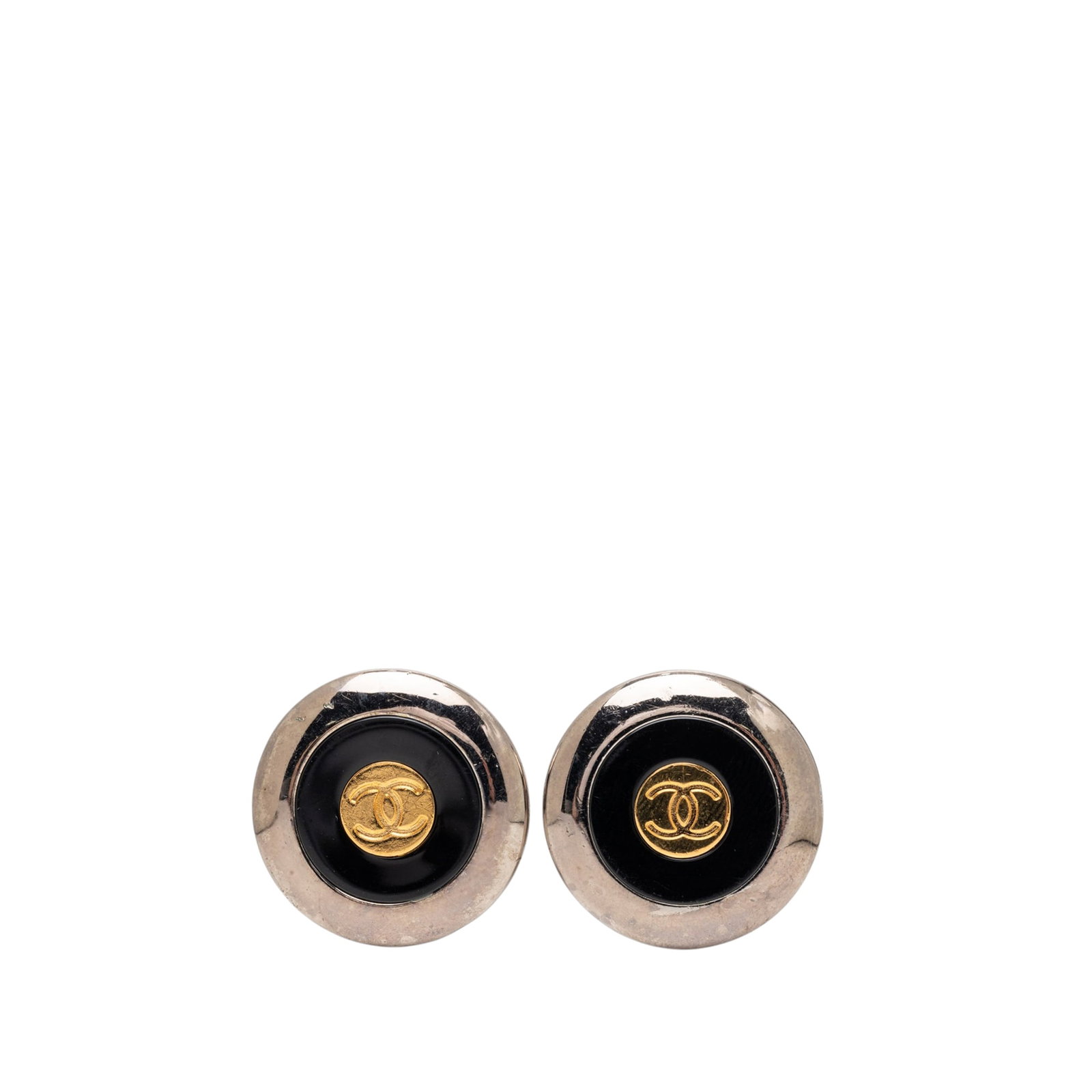 Chanel CC Clip On Earrings in Two Tone Brass Enamel: Chanel CC Clip On Earrings in Two Tone Brass Enamel Chanel CC clip-on earrings with a two-tone brass and enamel design. This costume jewelry pair is made in France and features the iconic CC motif wit
