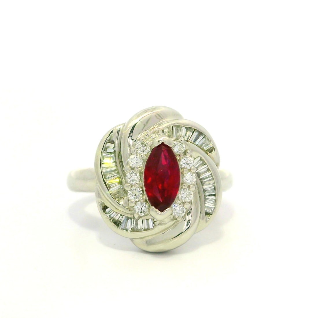 Platinum GIA Certified 1.1ctw Marquise Ruby Diamond Halo Ring: Platinum GIA Certified 1.1ctw Marquise Ruby Diamond Halo Ring This exquisite cocktail ring features a stunning natural marquise-cut ruby at its center, weighing 0.63ct and showcasing a vivid blood-red