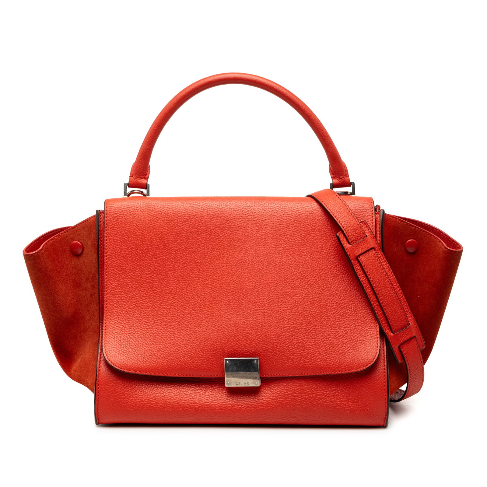 Celine Trapeze Medium Satchel in Drummed Calfskin and Suede Leather: Celine Trapeze Medium Satchel in Drummed Calfskin and Suede Leather This Celine Medium Drummed Calfskin and Suede Trapeze Satchel showcases a calf leather body with suede leather side panels, a rolled