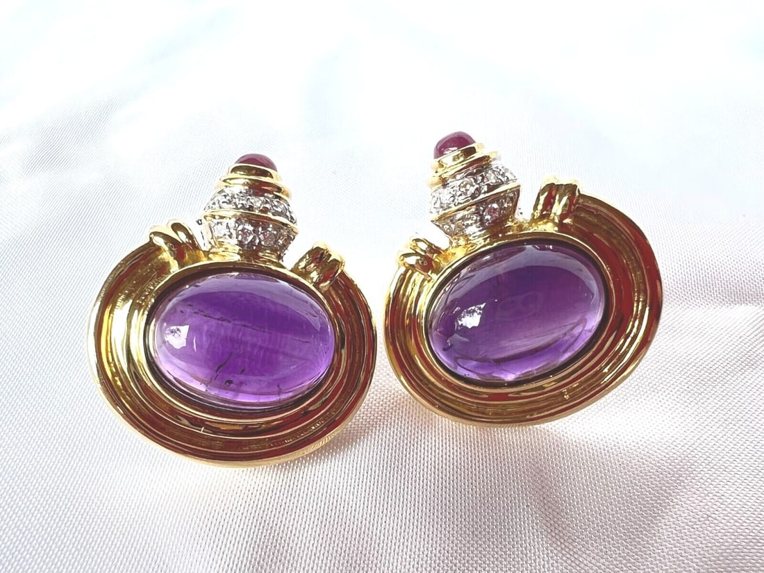 Elegant French 18K Gold Diamond Ruby Amethyst Earrings Set: Elegant French 18K Gold Diamond Ruby Amethyst Earrings Set Discover a stunning pair of French earrings crafted from 18K yellow gold, elegantly featuring a combination of amethyst, ruby, and diamond st