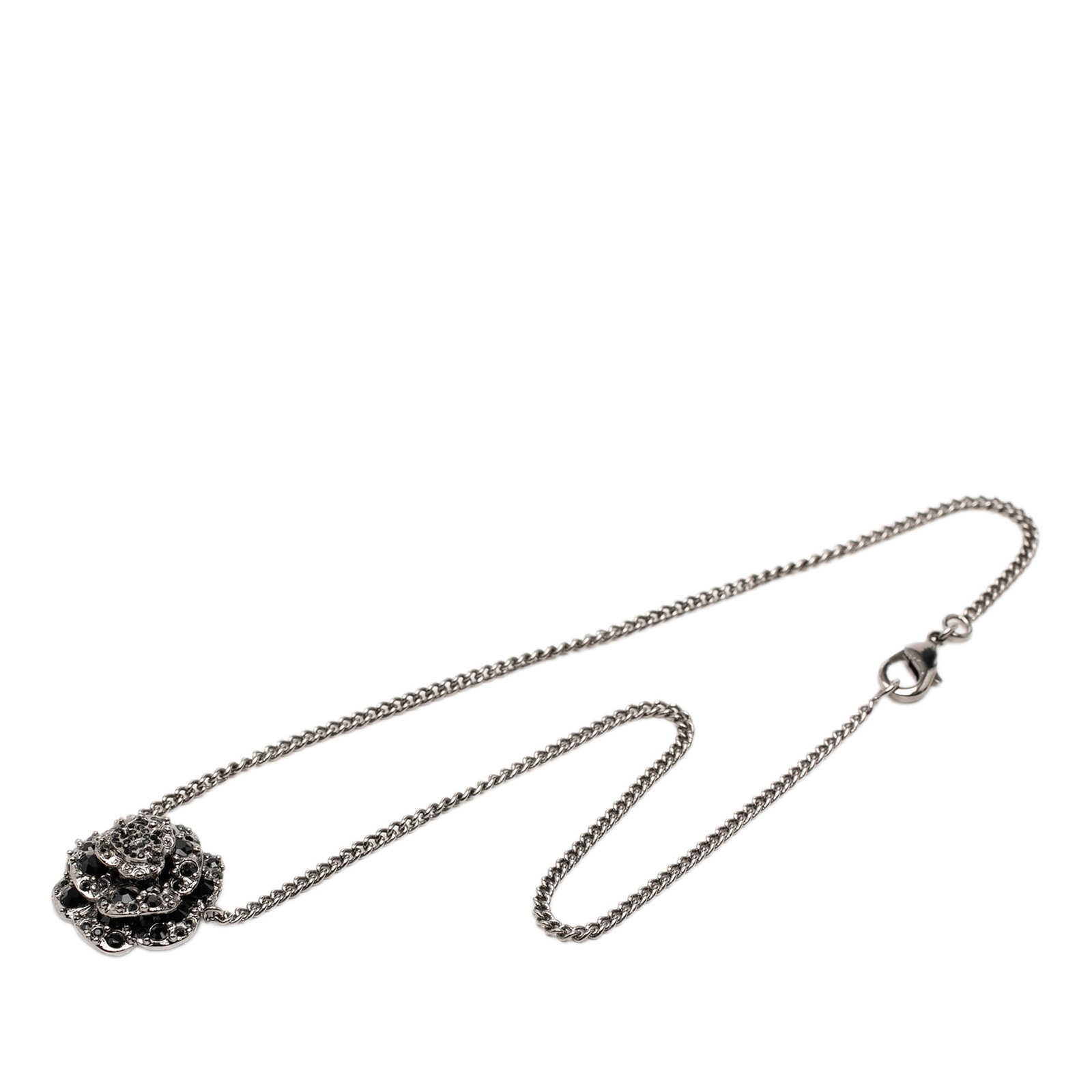 Chanel Camellia Pendant Necklace Silver Tone Metal Strass CC: Chanel Camellia Pendant Necklace Silver Tone Metal Strass CC Chanel CC Brass Strass Camellia Pendant Necklace in silver-tone metal, featuring a camellia pendant with strass embellishment and a lobster
