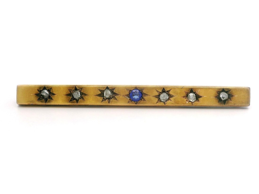 Victorian 10k Gold Bar Pin with Diamond and Blue Stone: Victorian 10k Gold Bar Pin with Diamond and Blue Stone This exquisite Antique Early Victorian bar pin showcases a stunning arrangement of natural genuine diamonds and a blue stone. Crafted from solid 