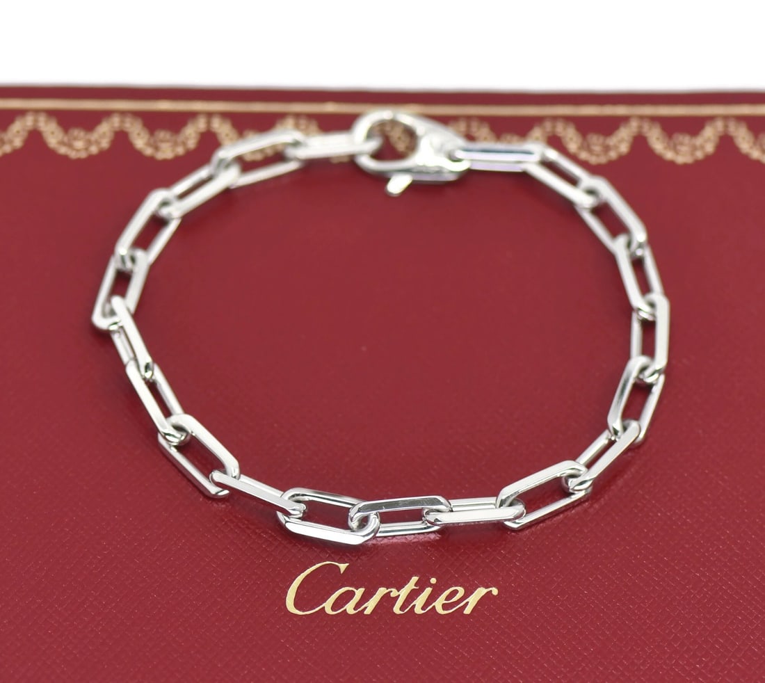Santos Chain Bracelet in 18K White Gold by Cartier with Pouch and Certificate: Santos Chain Bracelet in 18K White Gold by Cartier with Pouch and Certificate This Cartier Santos bracelet is crafted from 18K white gold and features a chain style design. It is part of the Cartier S