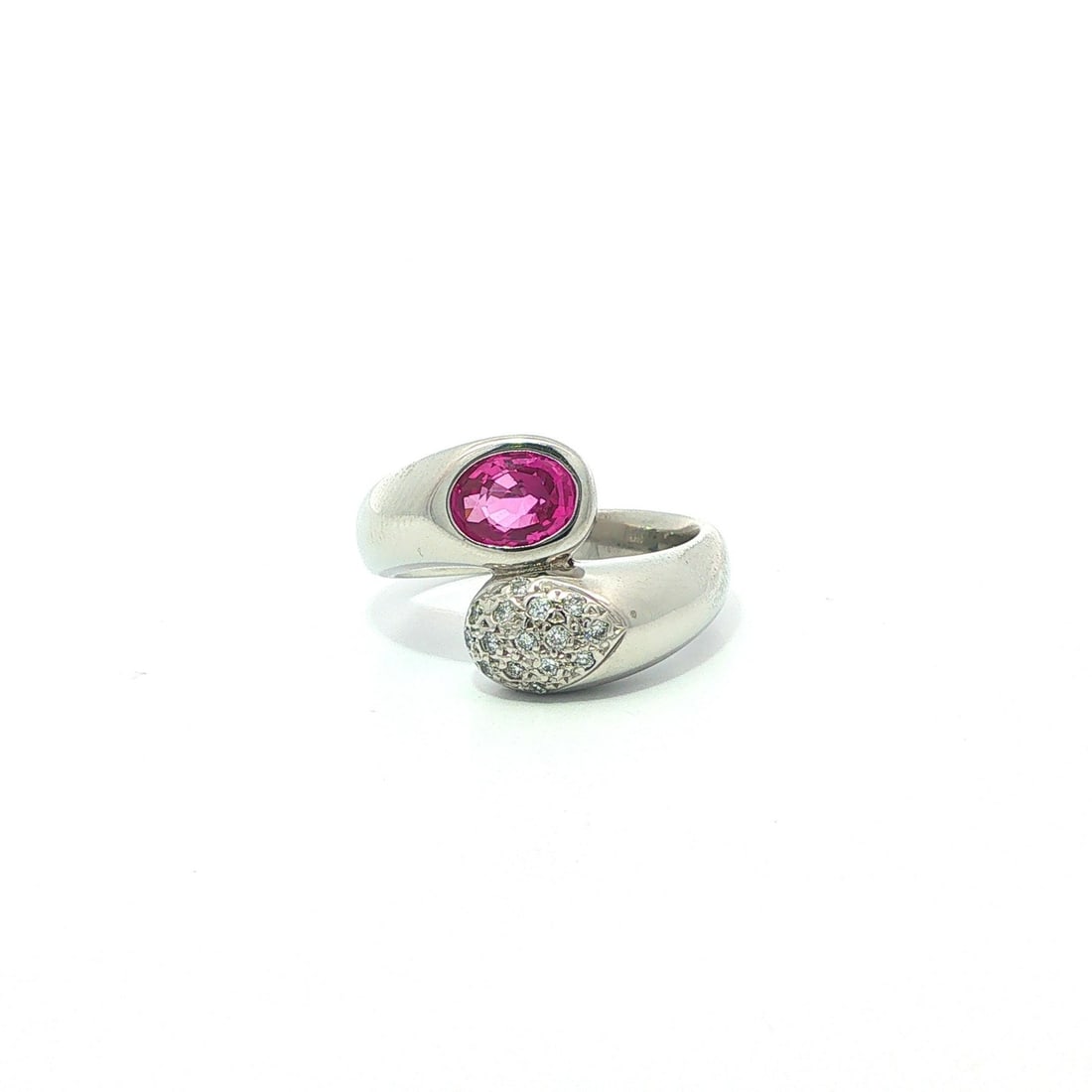 Pink Sapphire Diamond Platinum Bypass Ring 6.5: Pink Sapphire Diamond Platinum Bypass Ring 6.5 This elegant bypass ring is crafted from solid platinum and features a bezel-set oval natural pink sapphire weighing 0.96 carats. Accentuating the sapphi