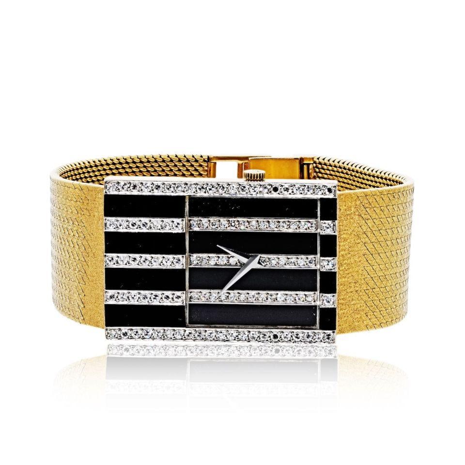 Chopard 2044 Ladies Gold Onyx Diamond Wristwatch: Chopard 2044 Ladies Gold Onyx Diamond Wristwatch This Chopard Gabel ladies wristwatch, reference 2044, is crafted from 18K yellow gold and features a distinctive rectangular dial adorned with black on