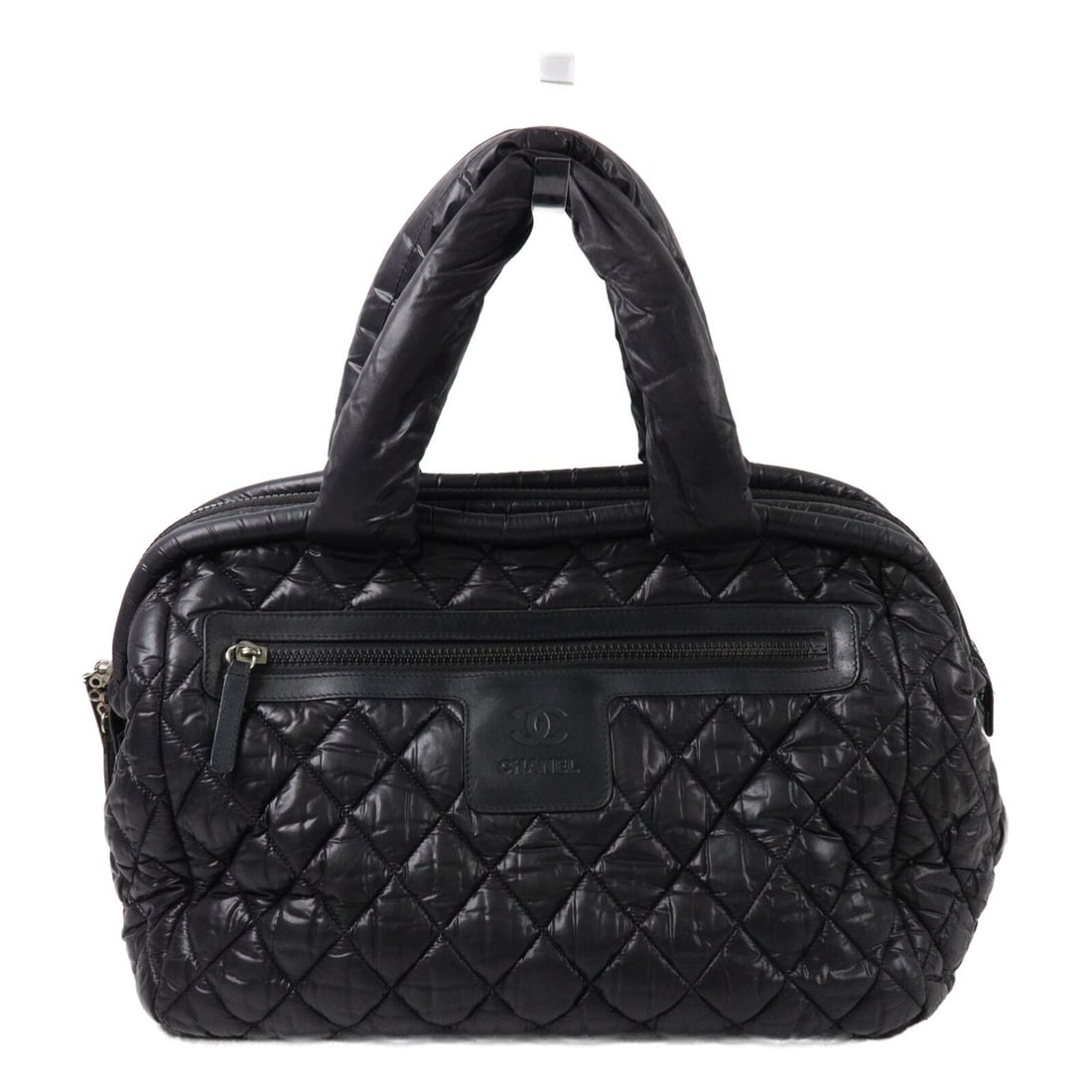 CHANEL Coco Cocoon CC Nylon Tote Black: CHANEL Coco Cocoon CC Nylon Tote Black CHANEL CC Coco Cocoon tote bag in black nylon. It features a black-on-black colorway, a handle drop of 42 cm, and multiple zip pockets. The bag comes with a holo