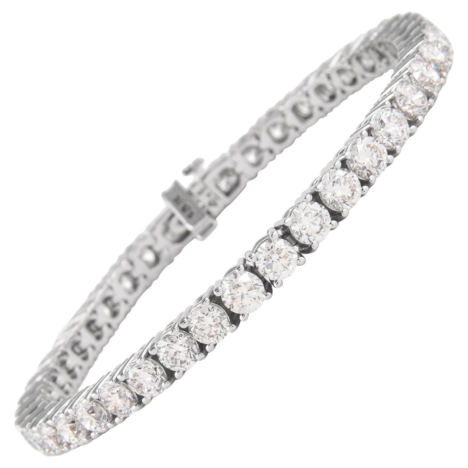 12.86ct G VS Diamond Tennis Bracelet 18k White Gold 7in: 12.86ct G VS Diamond Tennis Bracelet 18k White Gold 7in This exquisite and timeless diamond tennis bracelet features 42 round brilliant diamonds totaling 12.86 carats, showcasing approximately G color