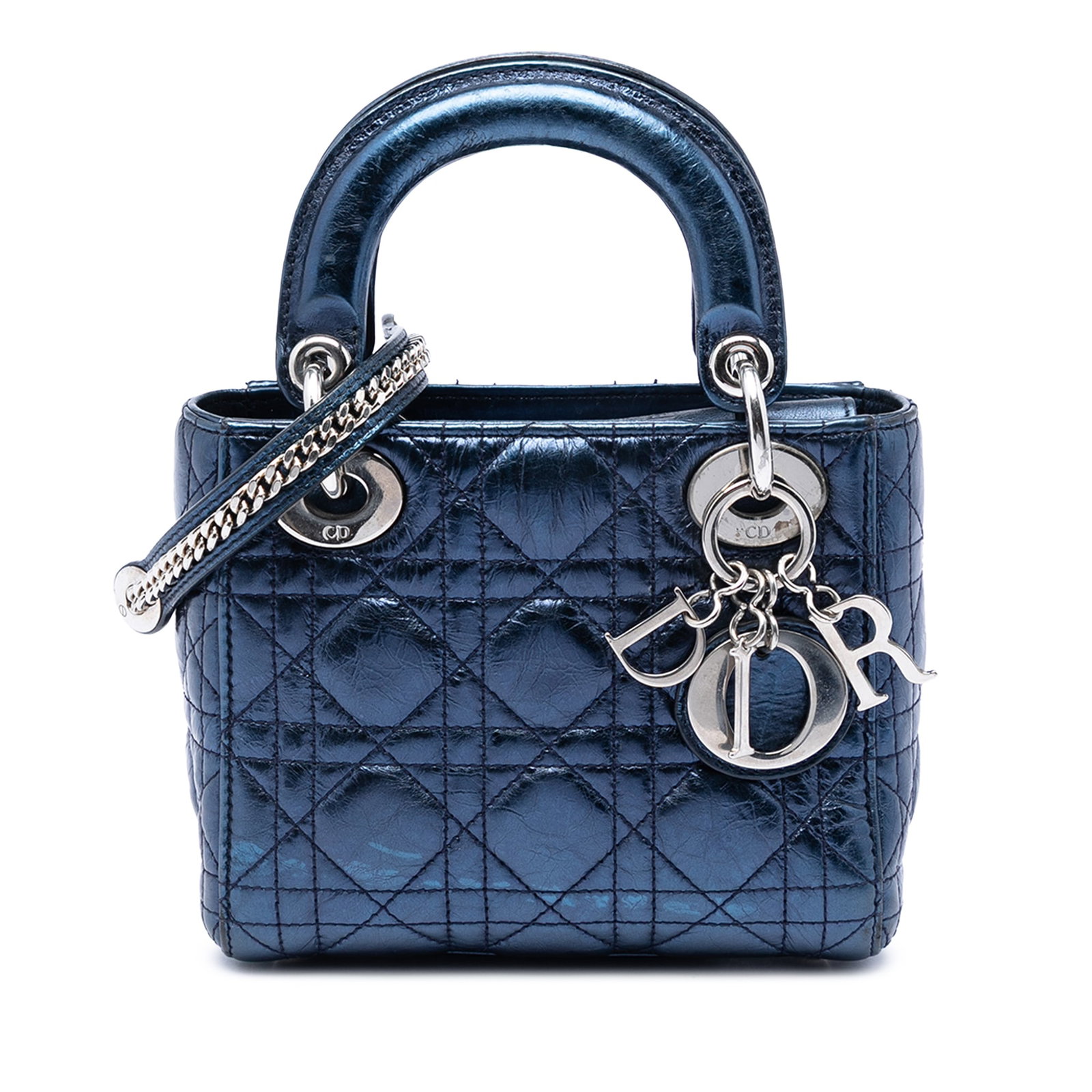 Dior Lady Dior Mini Blue Metallic Crinkled Lambskin Bag: Dior Lady Dior Mini Blue Metallic Crinkled Lambskin Bag A Mini Lady Dior bag in metallic crinkled lambskin with the signature Cannage quilted body. It features flat leather top handles, a detachable