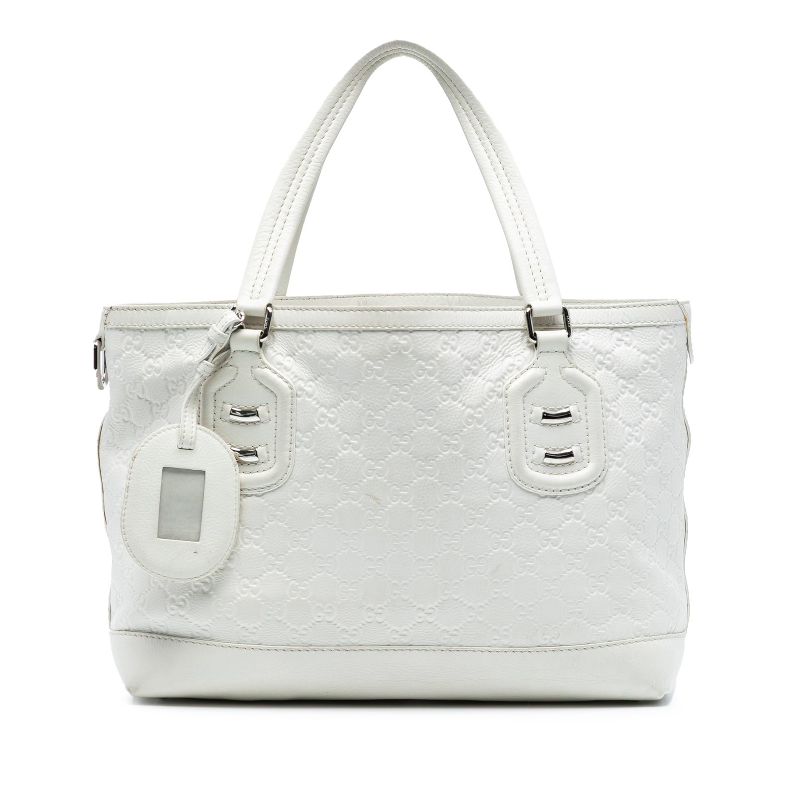 Gucci Guccissima Techno Tag Tote White Leather Handbag: Gucci Guccissima Techno Tag Tote White Leather Handbag Introducing the Guccissima Techno Tag Tote, a stylish and functional accessory crafted from high-quality leather. This tote features flat leather