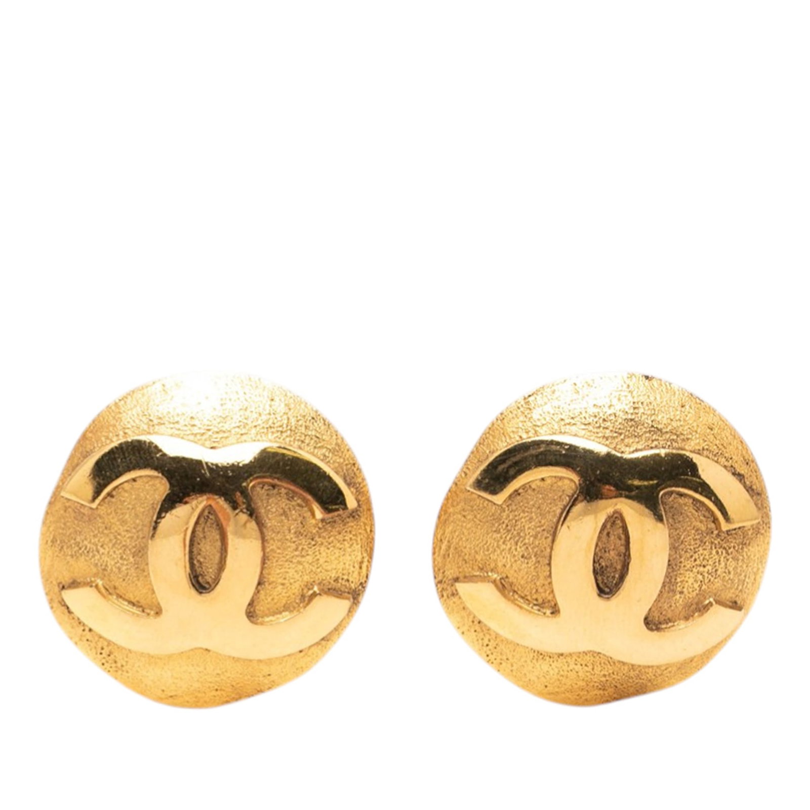 Chanel CC Round Clip On Earrings in Gold Plated Metal: Chanel CC Round Clip On Earrings in Gold Plated Metal These Chanel earrings feature round gold plated metal bodies with clip-on closures. Designed in France, they are part of the brand's iconic costum