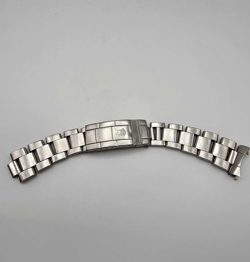 Rolex 93150 20mm Stainless Steel Watch Band: Rolex 93150 20mm Stainless Steel Watch Band This Rolex 93150 Oyster bracelet is crafted from stainless steel and designed for the Submariner model. It features a 20mm band width and a 6-inch length, s