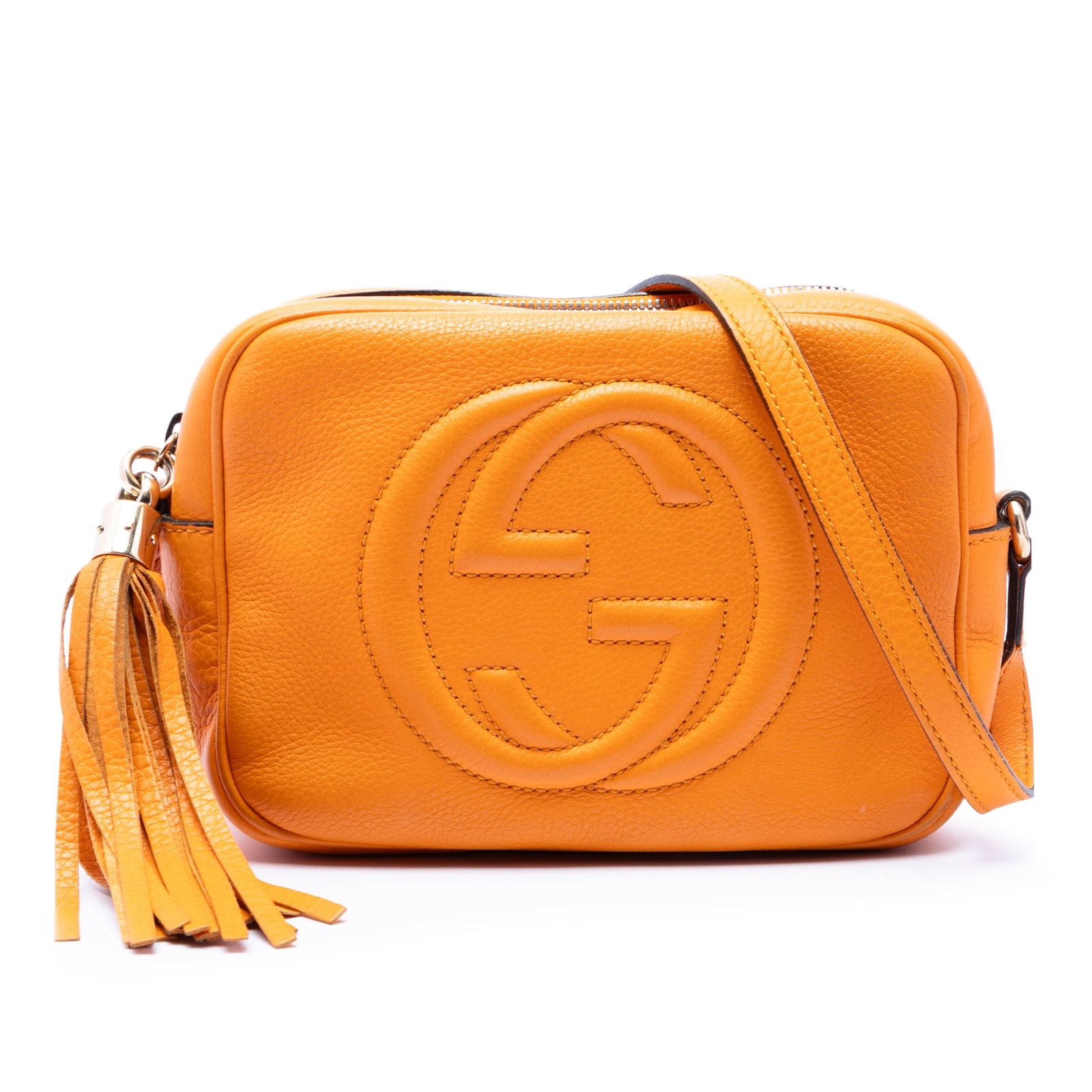 Gucci Soho Disco Calfskin Leather Crossbody Bag Orange: Gucci Soho Disco Calfskin Leather Crossbody Bag Orange Gucci Soho Disco Crossbody in orange calfskin leather with a tassel detail and top zip closure. The bag features an adjustable flat leather strap