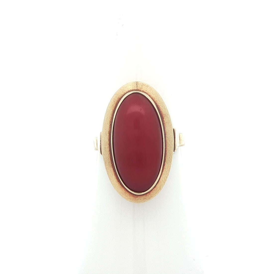 Elongated Oval Red Coral Cabochon Ring in Vintage 14k Yellow Gold: Elongated Oval Red Coral Cabochon Ring in Vintage 14k Yellow Gold This vintage ring features a natural red coral stone in an elongated oval cabochon cut, bezel set in solid 14k yellow gold. The ring s