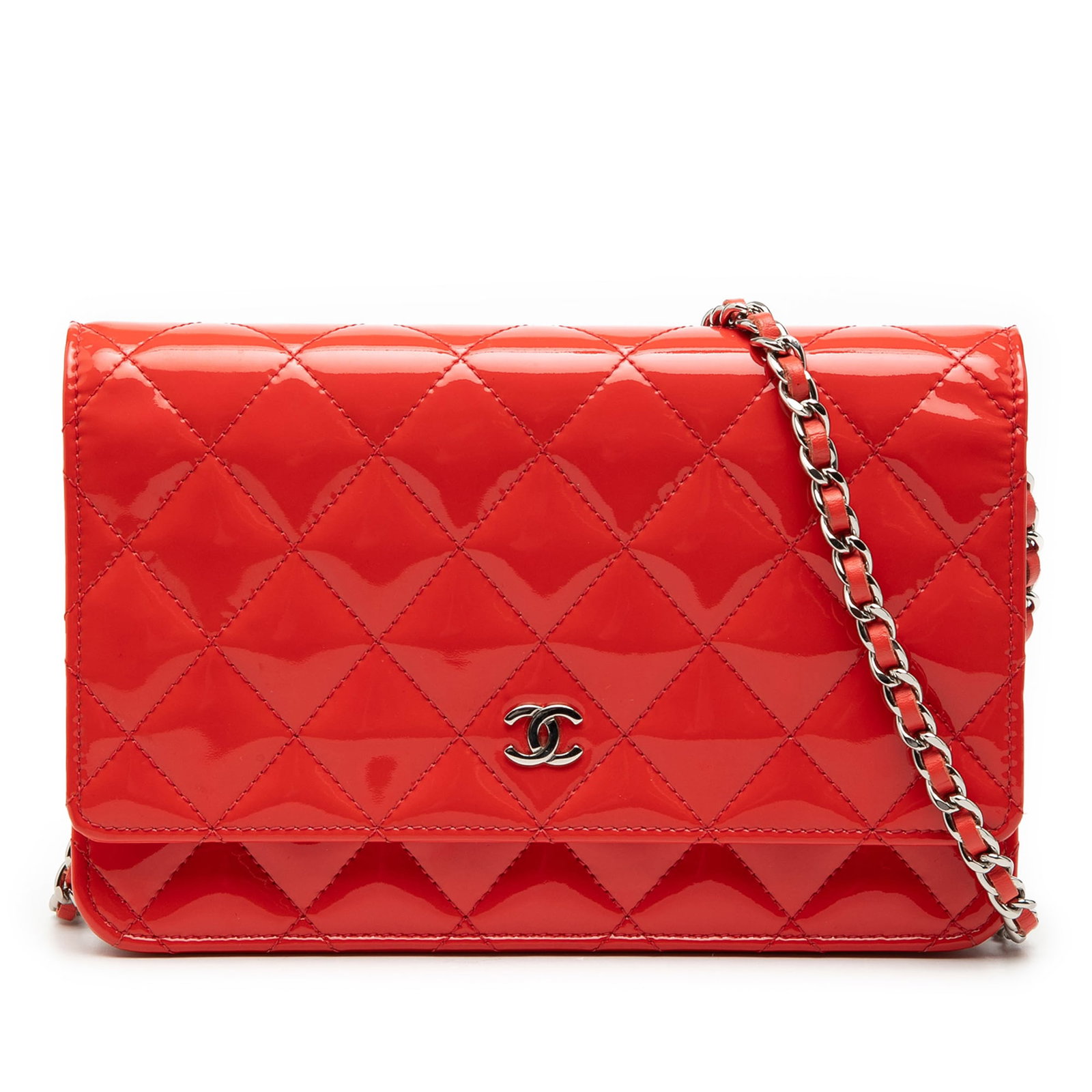 Chanel CC Patent Leather Wallet on Chain Orange: Chanel CC Patent Leather Wallet on Chain Orange Chanel CC Patent Wallet on Chain in orange quilted patent leather. This bag features a leather-woven chain strap, a flap with magnetic snap closure, an 