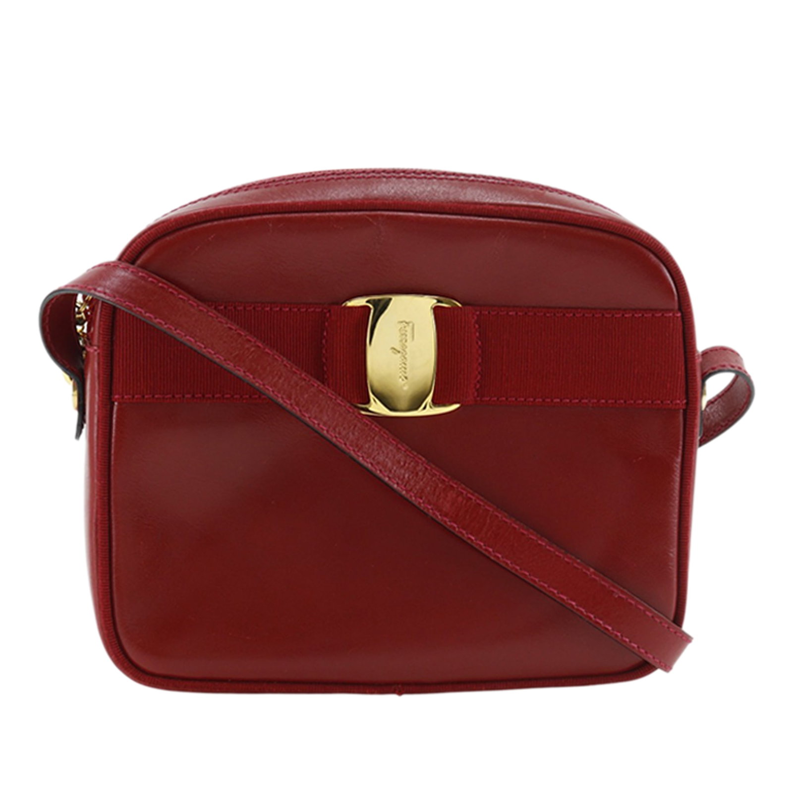 Ferragamo Vara Bow Leather Red Crossbody Bag: Ferragamo Vara Bow Leather Red Crossbody Bag This Ferragamo Leather Vara Bow Crossbody bag is crafted from red leather and features an adjustable flat leather shoulder strap, a top zip closure, and an