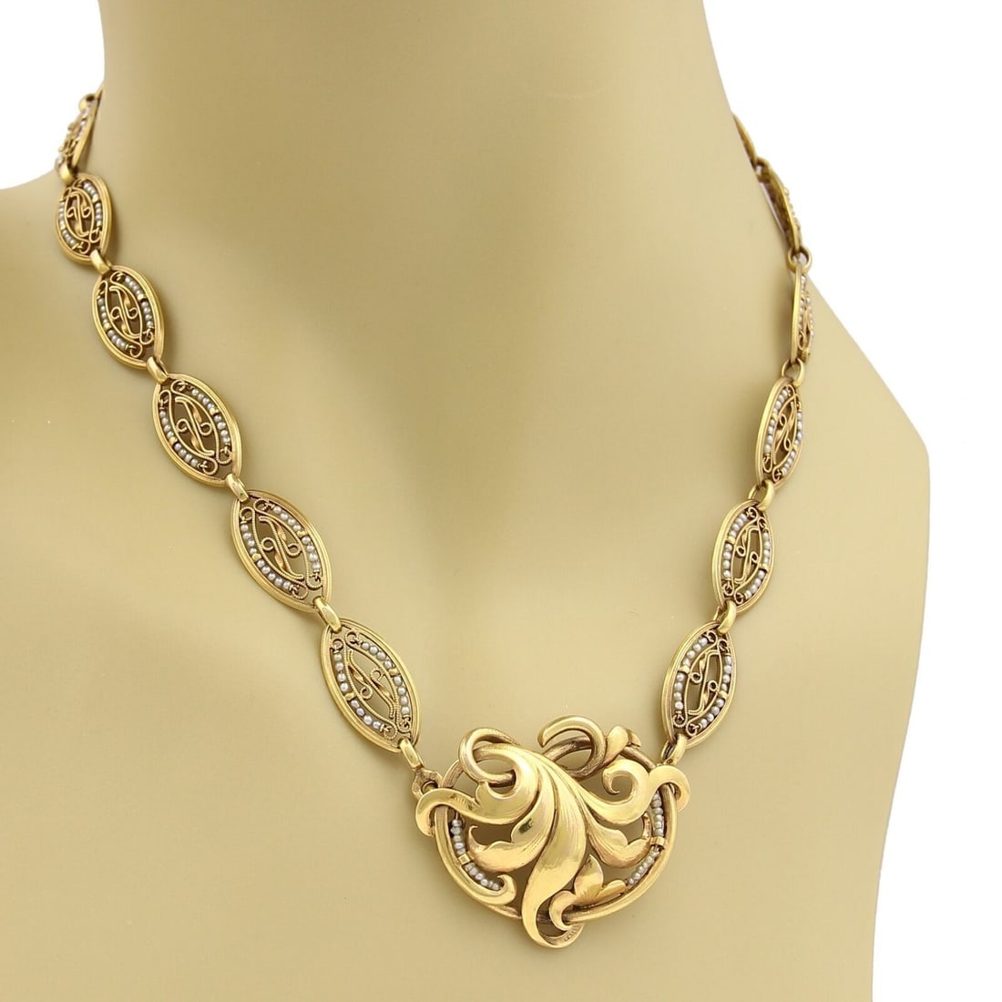 Vintage 18k Yellow Gold Choker Necklace with Seed Pearl Floral Pendant: Vintage 18k Yellow Gold Choker Necklace with Seed Pearl Floral Pendant This vintage estate choker necklace is crafted in solid 18k yellow gold and features floral-inspired fancy links accented with de