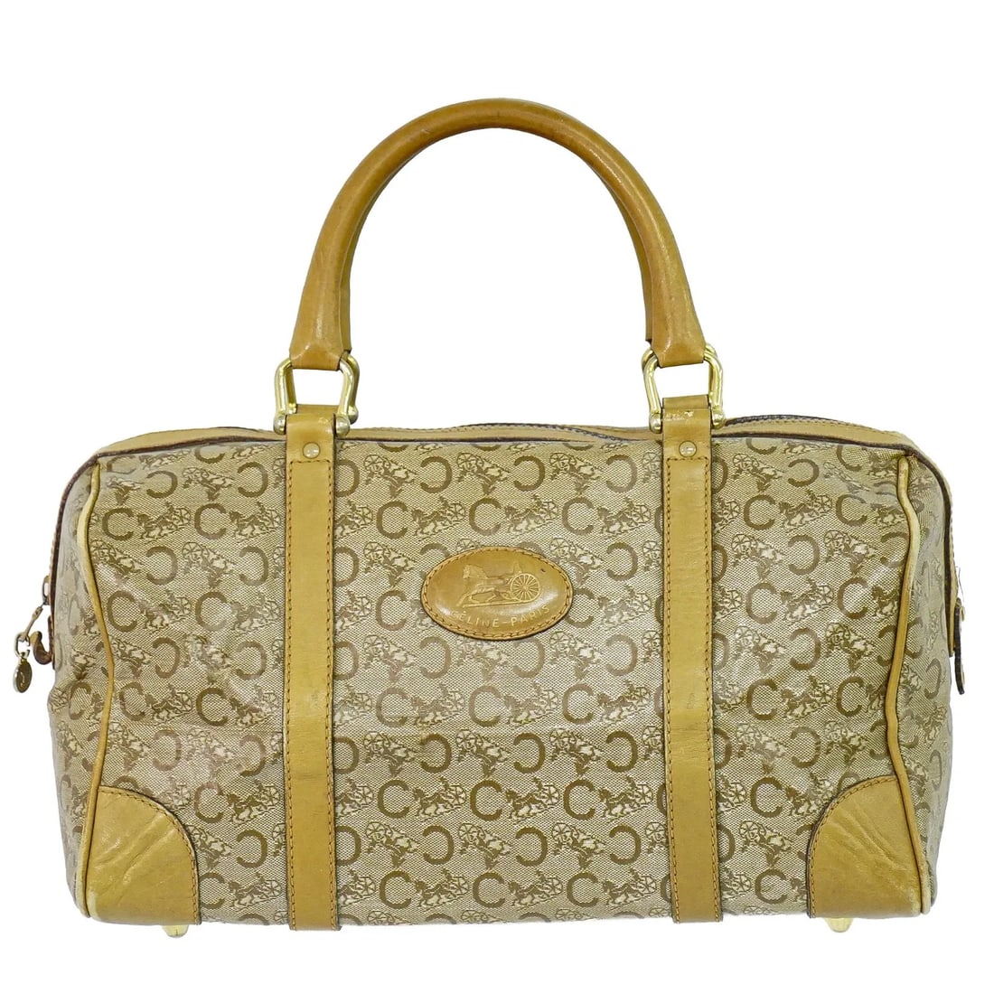 Celine Vintage Duffle Bag PVC Beige: Celine Vintage Duffle Bag PVC Beige This Celine vintage duffle bag is crafted from durable beige PVC canvas with leather accents. Designed for women, the bag features a spacious interior, ideal for ev