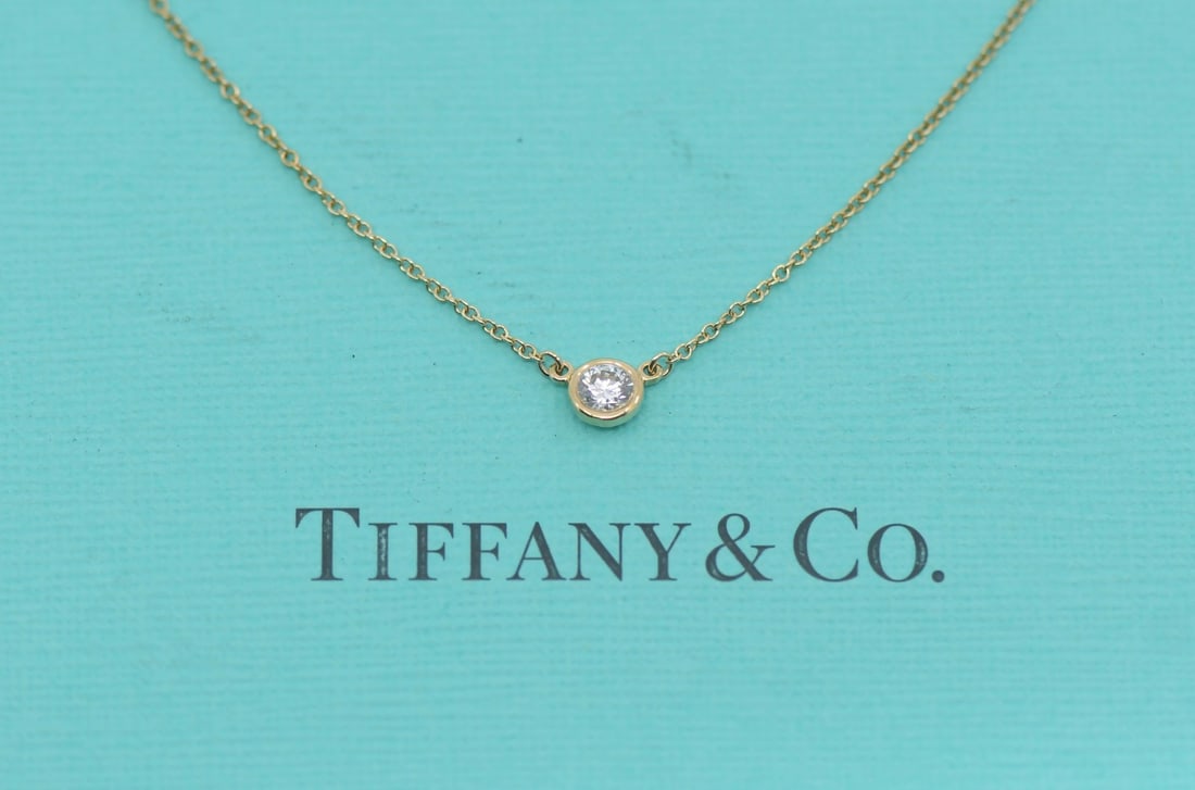 Tiffany & Co Elsa Peretti Diamonds By Yard 18K Gold Necklace 0.12 CT: Tiffany & Co Elsa Peretti Diamonds By Yard 18K Gold Necklace 0.12 CT Tiffany & Co. Elsa Peretti Diamonds by the Yard necklace in 18k yellow gold, featuring diamonds and a chain style. Made in Italy, t