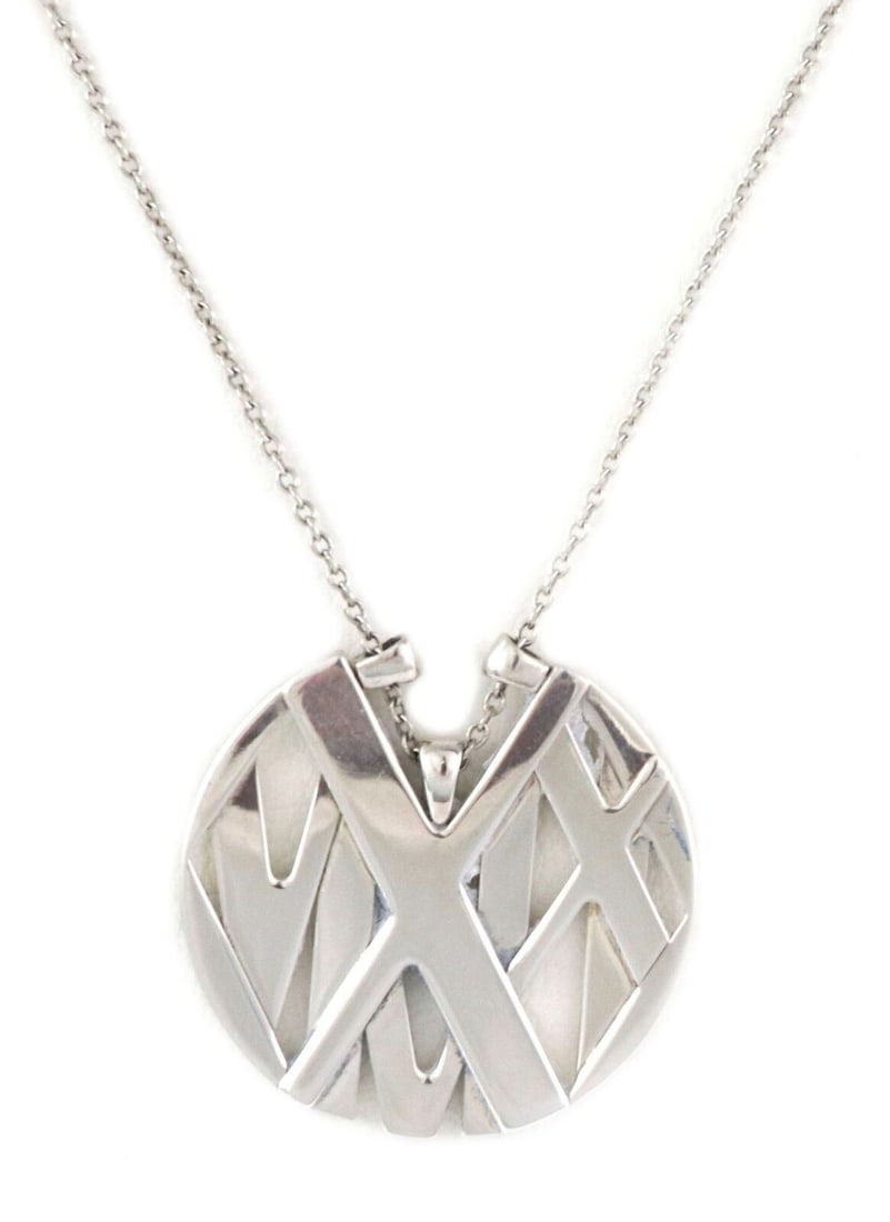 Tiffany & Co. Atlas Sterling Silver Round Medallion Pendant Necklace: Tiffany & Co. Atlas Sterling Silver Round Medallion Pendant Necklace A pre-owned Tiffany & Co. Atlas Round Medallion pendant necklace crafted in polished sterling silver. It features the collection's 