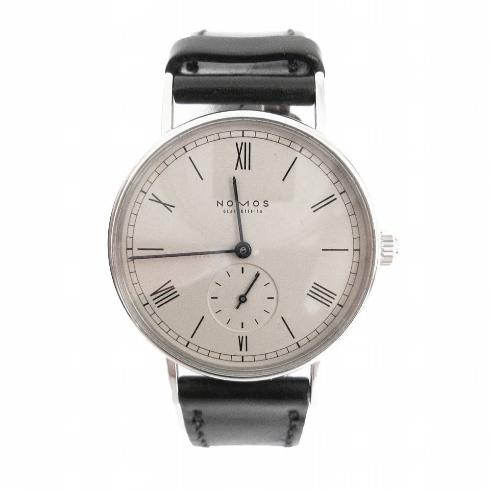 NOMOS Glashutte Ludwig Edelstahl 33mm manual wind wristwatch: NOMOS Glashutte Ludwig Edelstahl 33mm manual wind wristwatch This pre-owned NOMOS Glashutte men's wristwatch features a manual winding movement and a white dial with a silver case and black strap. The