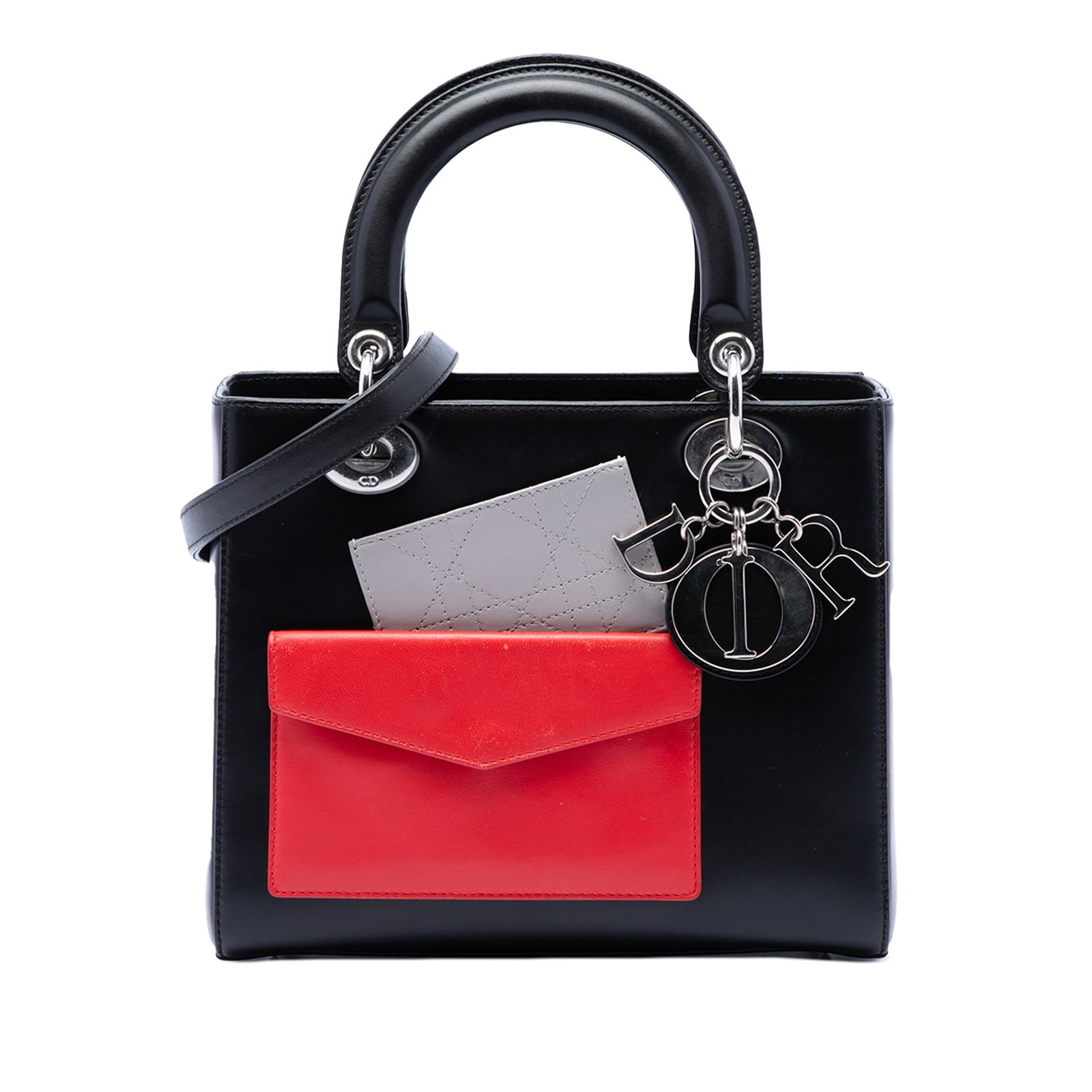 Dior Lady Dior Medium Calfskin Pocket Bag Black: Dior Lady Dior Medium Calfskin Pocket Bag Black This Lady Dior bag is crafted in leather with a leather body and flat leather top handles. It also features a detachable flat shoulder strap, a top zip 