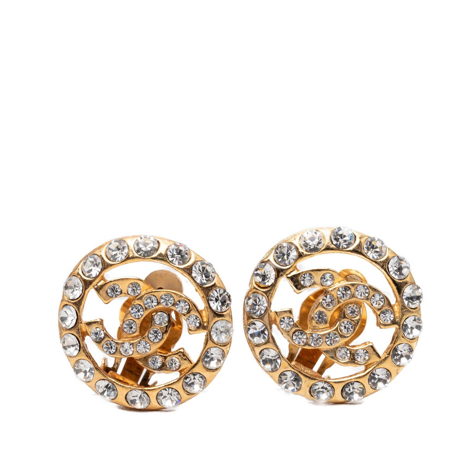 Chanel CC Round Clip Earrings Gold Plated Strass: Chanel CC Round Clip Earrings Gold Plated Strass Chanel CC round clip-on earrings in gold plated metal with strass embellishments. Made in France and presented as costume jewelry, these earrings have 
