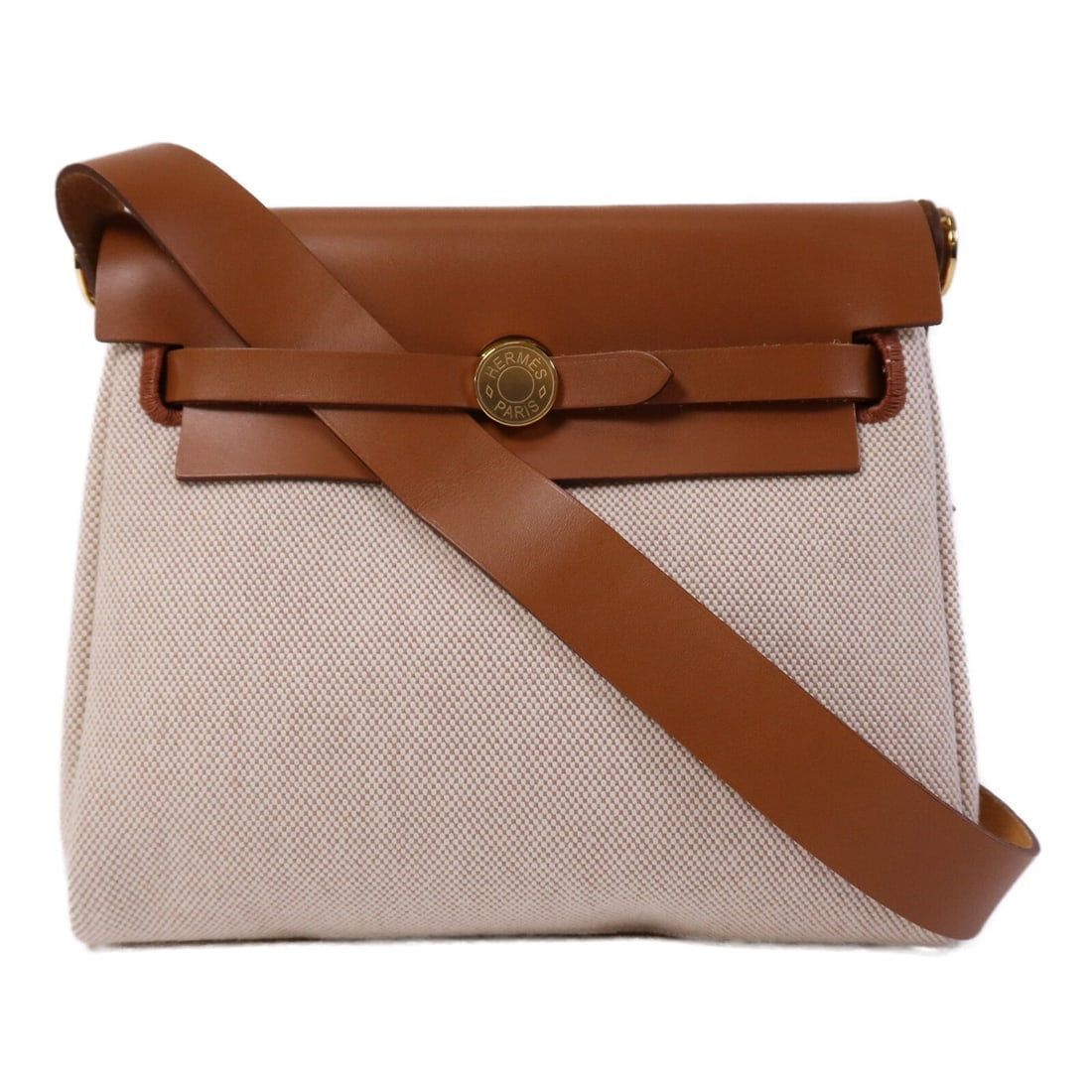 Hermes Mini Herbag Canvas Shoulder Bag Fauve Beige GHW: Hermes Mini Herbag Canvas Shoulder Bag Fauve Beige GHW Hermes Mini Herbag shoulder bag in canvas Fauve with beige exterior accents. This women's regular-size shoulder bag is made in France and comes w