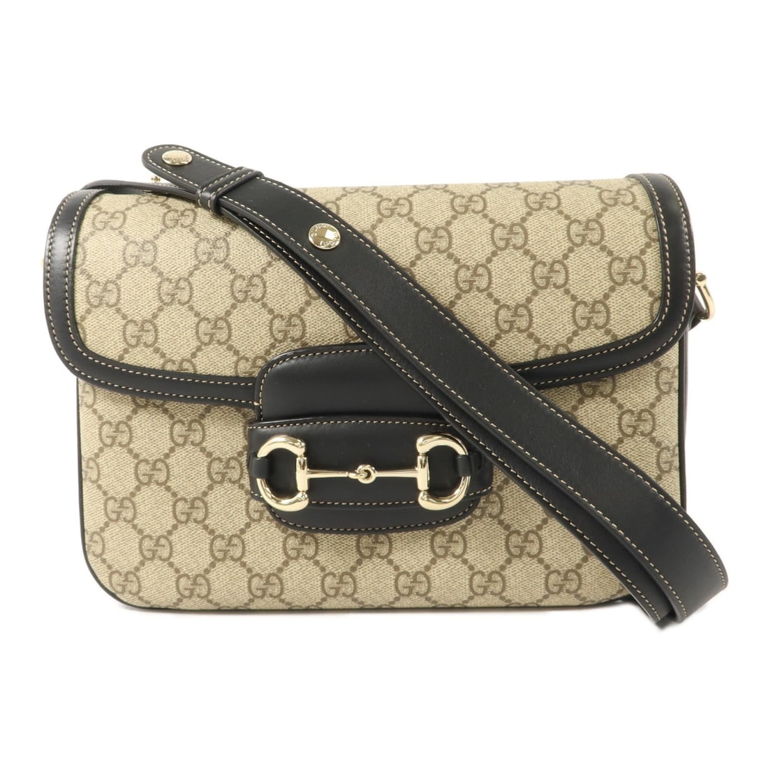Gucci Horsebit 1955 Medium Shoulder Bag 815178 GG Coated Canvas: Gucci Horsebit 1955 Medium Shoulder Bag 815178 GG Coated Canvas A Gucci GG Horsebit 1955 medium shoulder bag in brown and black PVC coated canvas with gold-tone hardware. It features a flap closure, o