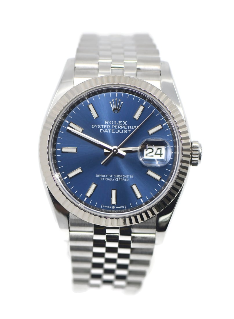 Rolex 126234 Datejust 36mm wristwatch blue dial fluted bezel: Rolex 126234 Datejust 36mm wristwatch blue dial fluted bezel Pre-owned Rolex Datejust 36 wristwatch with a blue dial and stainless steel construction. It features a fluted silver bezel, polished silve