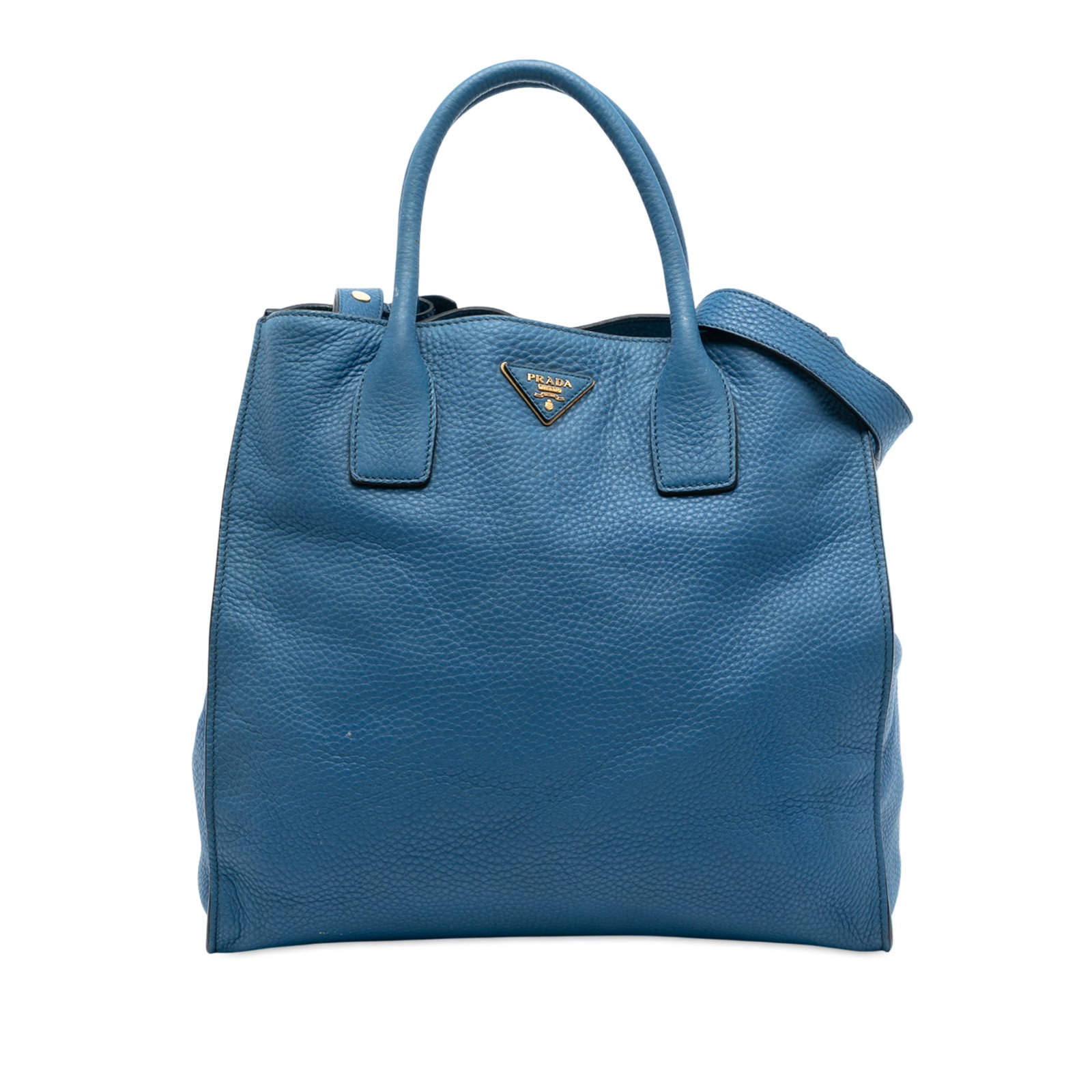 Prada Vitello Daino Leather Convertible Satchel with Detachable Strap: Prada Vitello Daino Leather Convertible Satchel with Detachable Strap This Prada Vitello Daino Open Convertible Tote showcases a blue leather exterior with rolled leather handles and a detachable flat