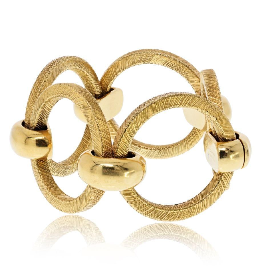 18K Yellow Gold Bracelet Tiffany & Co. Georges L: 18K Yellow Gold Bracelet Tiffany & Co. Georges L Pre-owned Tiffany & Co. bracelet in 18K yellow gold. The piece is identified as a bracelet and is described as weighing 95 grams. Specifications Type: 