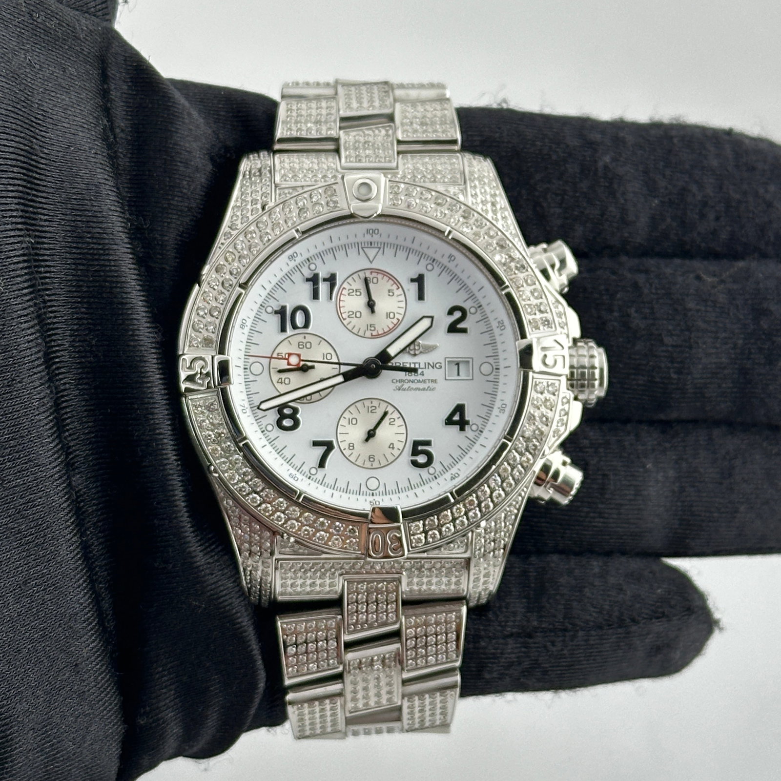 Super Avenger A13370 Mens Watch White Arabic Dial Diamond Bezel and Bracelet: Super Avenger A13370 Mens Watch White Arabic Dial Diamond Bezel and Bracelet This Breitling Super Avenger features a white Arabic dial and is enhanced with a diamond-set bezel and bracelet. The watch 
