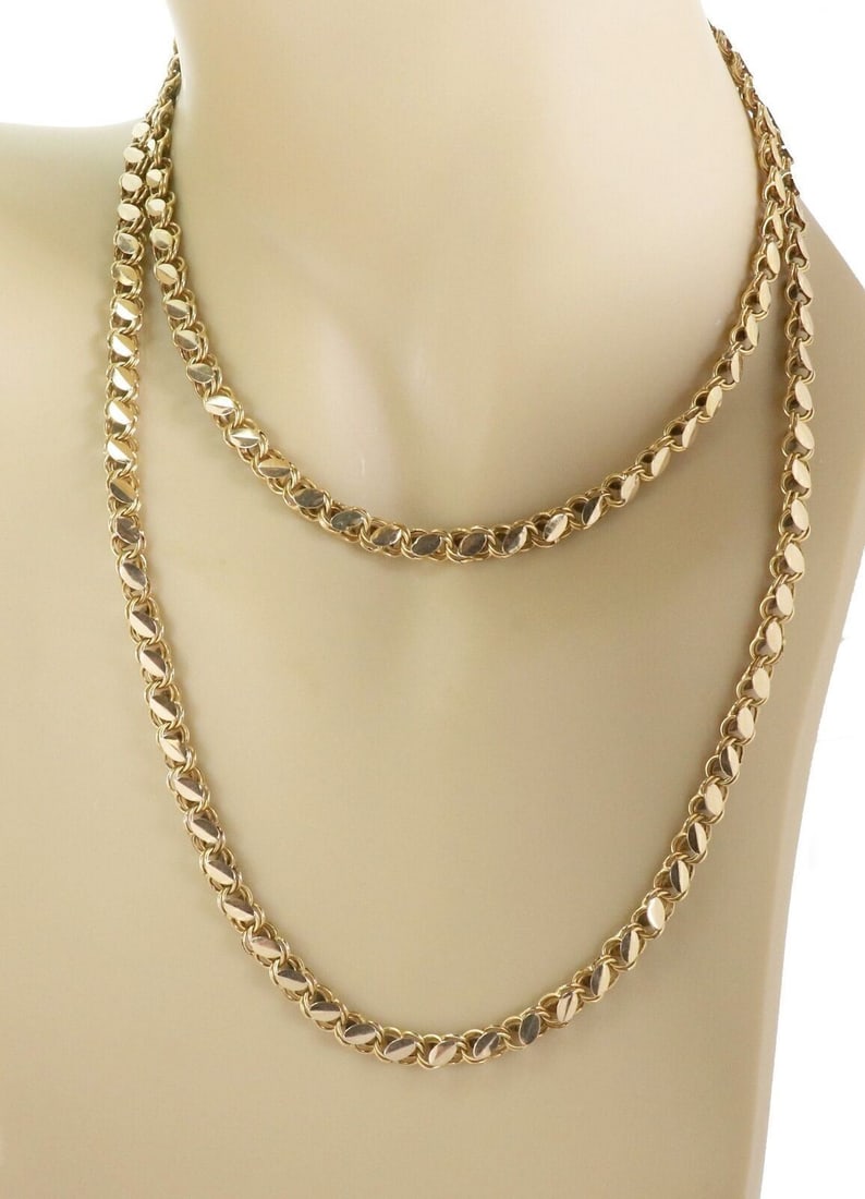 Vintage 36in Charm Link Necklace in 18K Yellow Gold: Vintage 36in Charm Link Necklace in 18K Yellow Gold This vintage estate charm link long chain necklace is crafted in solid 18k yellow gold and features a sculptural link design with a warm polished fi