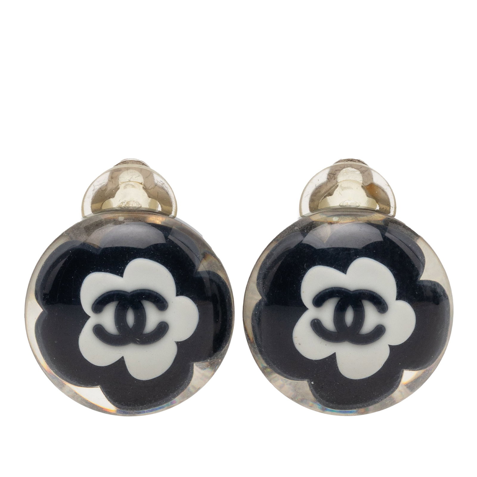 Chanel CC Resin Flower Clip On Costume Earrings: Chanel CC Resin Flower Clip On Costume Earrings These Chanel CC Resin Flower Clip On Earrings feature a black resin and silver plated metal construction with a floral design. They are designed with ba
