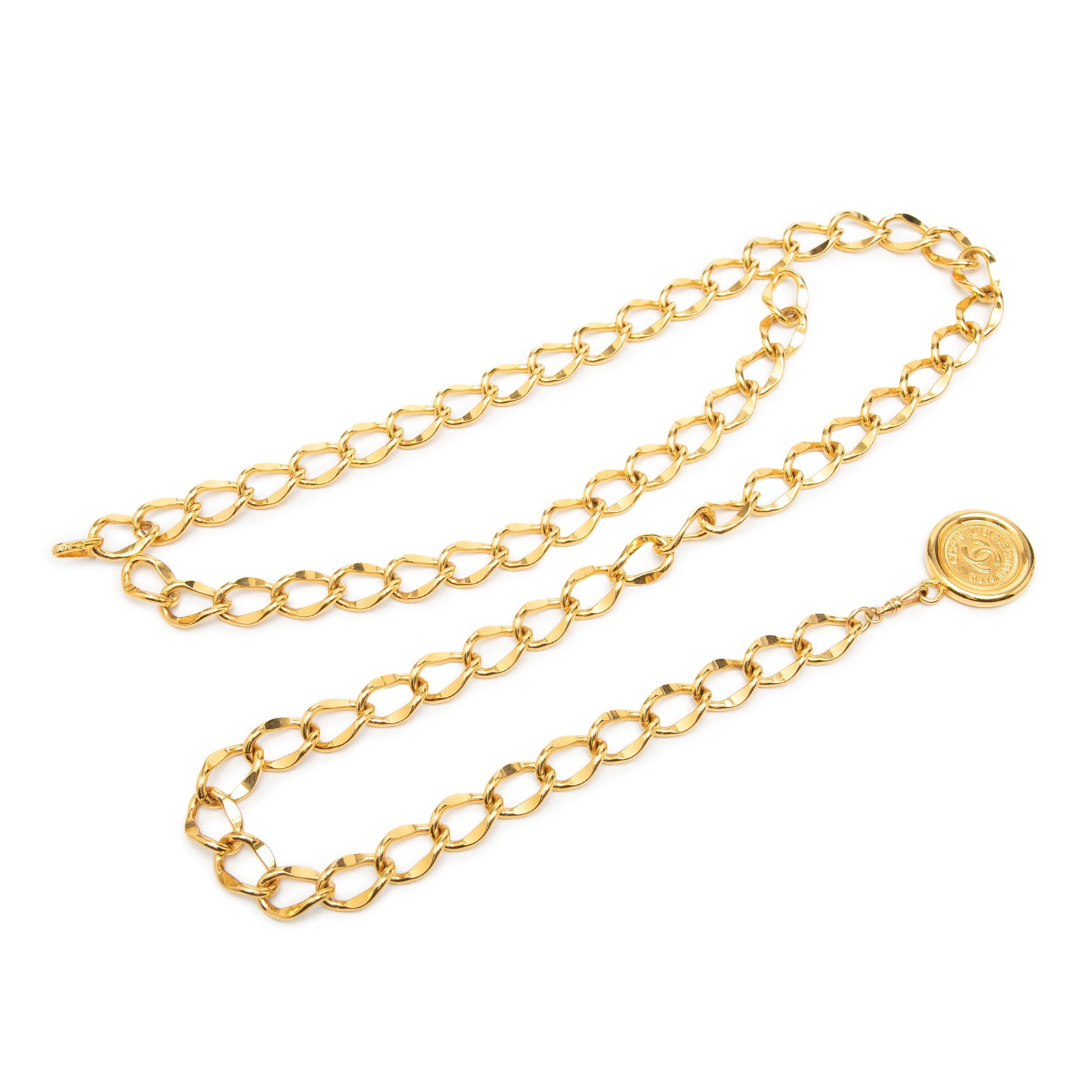 Chanel 31 Rue Cambon CC Medallion Gold Tone Chain Belt: Chanel 31 Rue Cambon CC Medallion Gold Tone Chain Belt Chanel chain belt featuring a gold tone metal design with a 31 Rue Cambon medallion charm and hook closure. Made in France, this accessory has vi