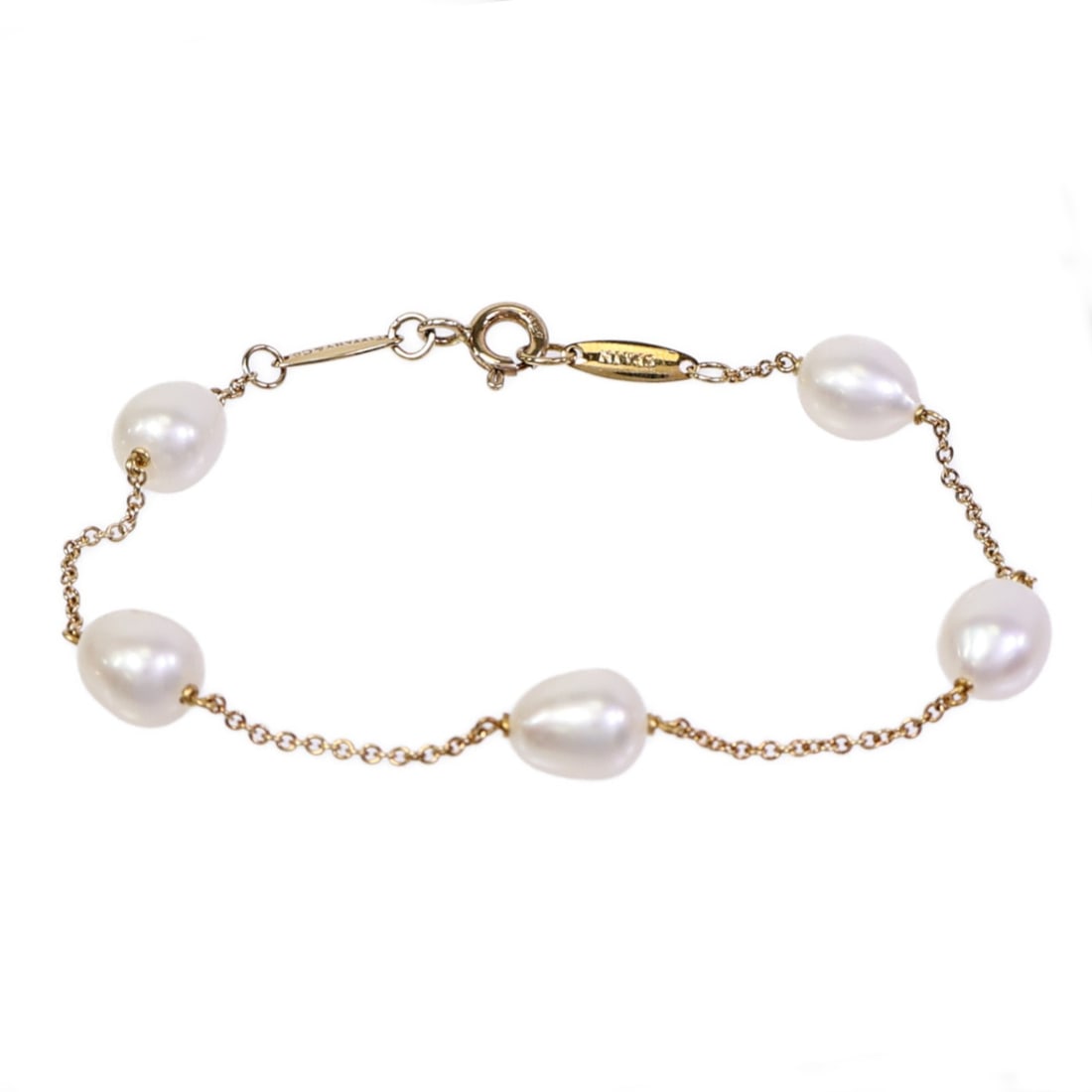 Tiffany Co Pearls By The Yard 18K Yellow Gold Bracelet 14.5cm: Tiffany Co Pearls By The Yard 18K Yellow Gold Bracelet 14.5cm A Tiffany & Co. Pearls By The Yard bracelet in 18K yellow gold with white pearl accents. The bracelet is sized US#14.5 and is described as
