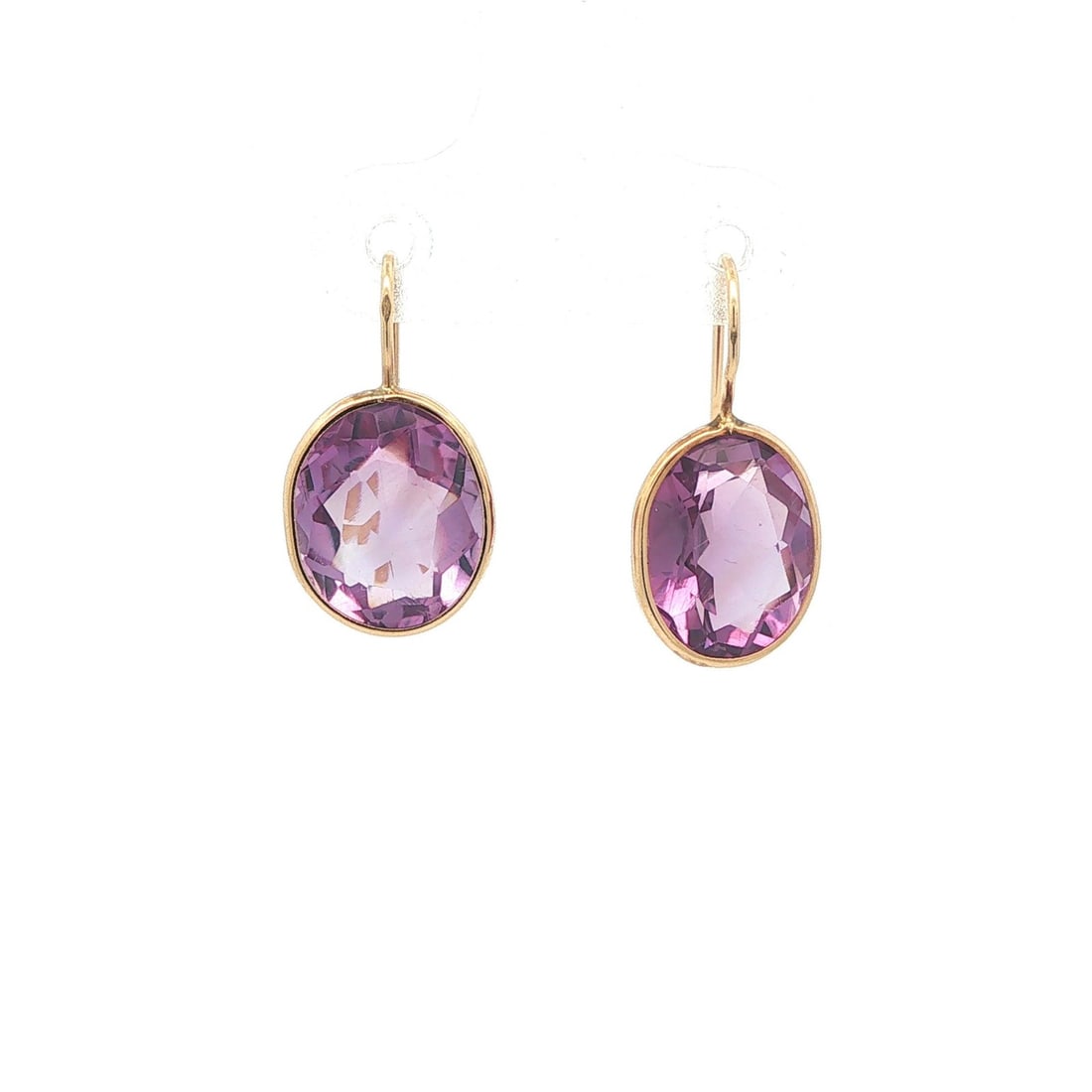 14k Yellow Gold Amethyst Oval Drop Earrings Fish Hook Wire: 14k Yellow Gold Amethyst Oval Drop Earrings Fish Hook Wire These elegant dangle earrings feature two natural oval-cut amethysts in a medium purple hue, each set in a bezel of solid 14k yellow gold. De
