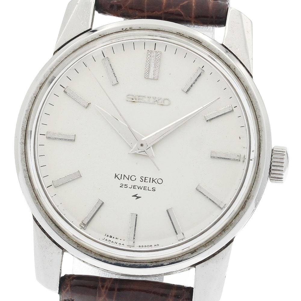 King Seiko 44-9990 Manual Wind Wristwatch Seiko: King Seiko 44-9990 Manual Wind Wristwatch Seiko This SEIKO KS King Seiko men's wristwatch, model 44-9990, features a stainless steel case and a silver dial paired with a leather strap. The watch is po